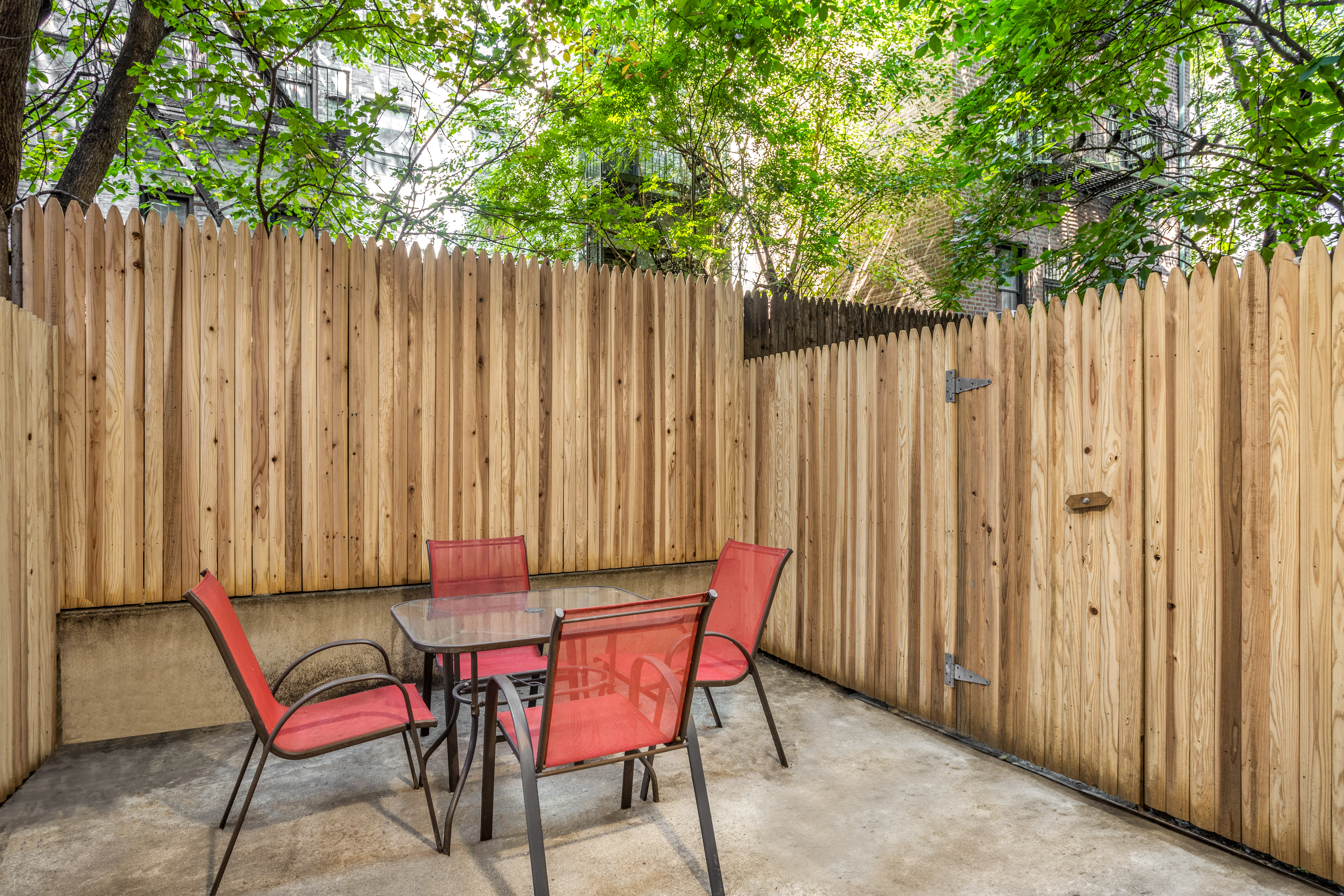 a view of outdoor space with a table and chairs