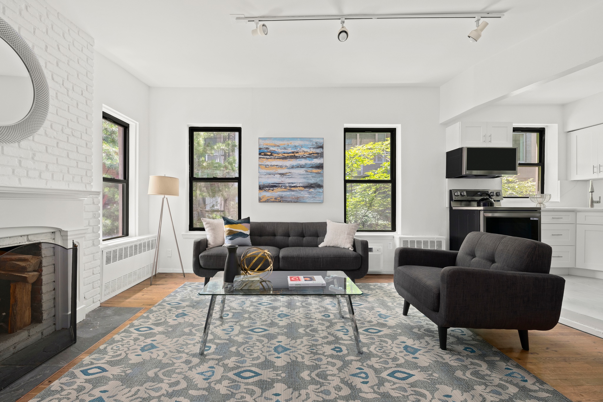 a living room with furniture fireplace and a flat screen tv