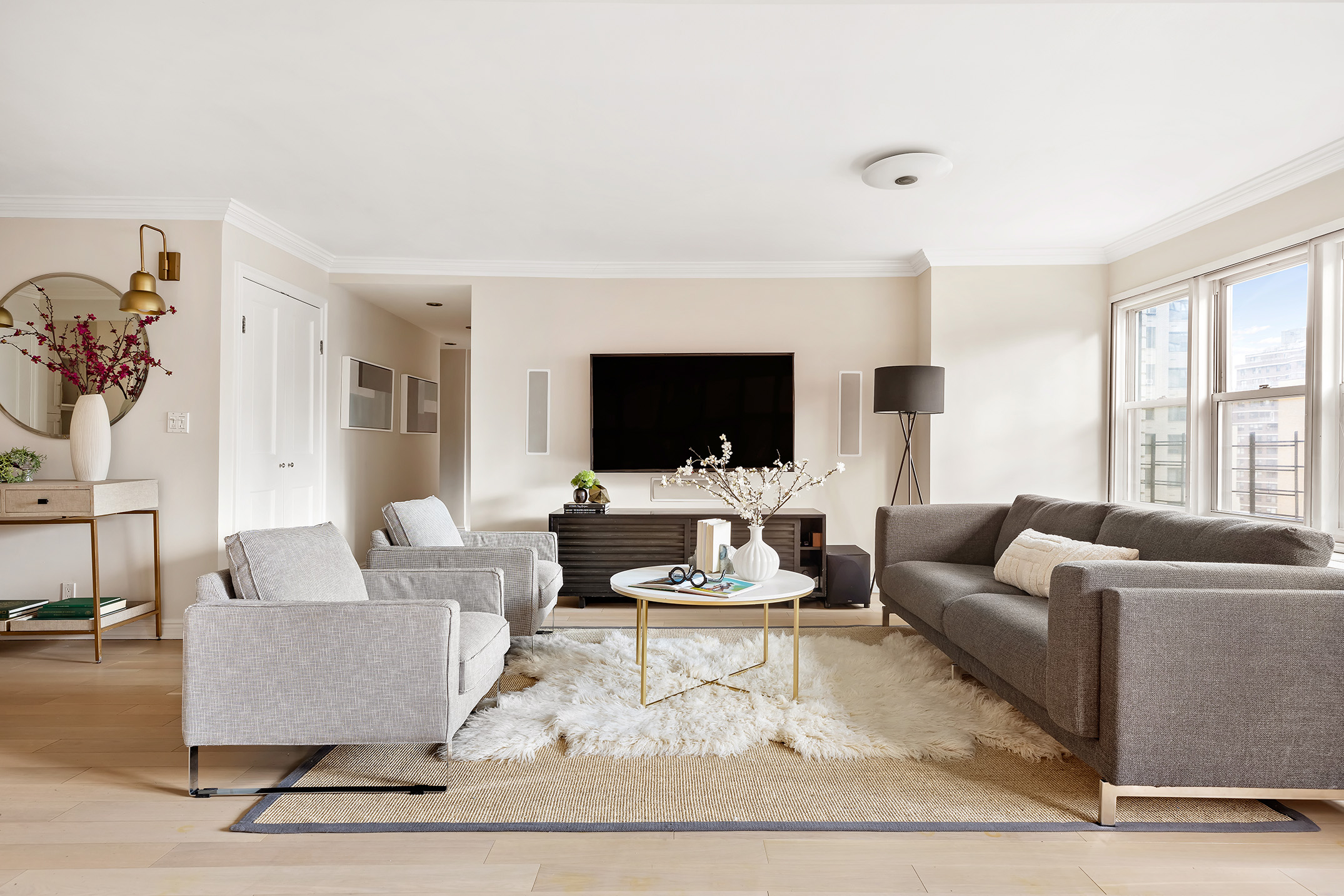 a living room with furniture and a flat screen tv