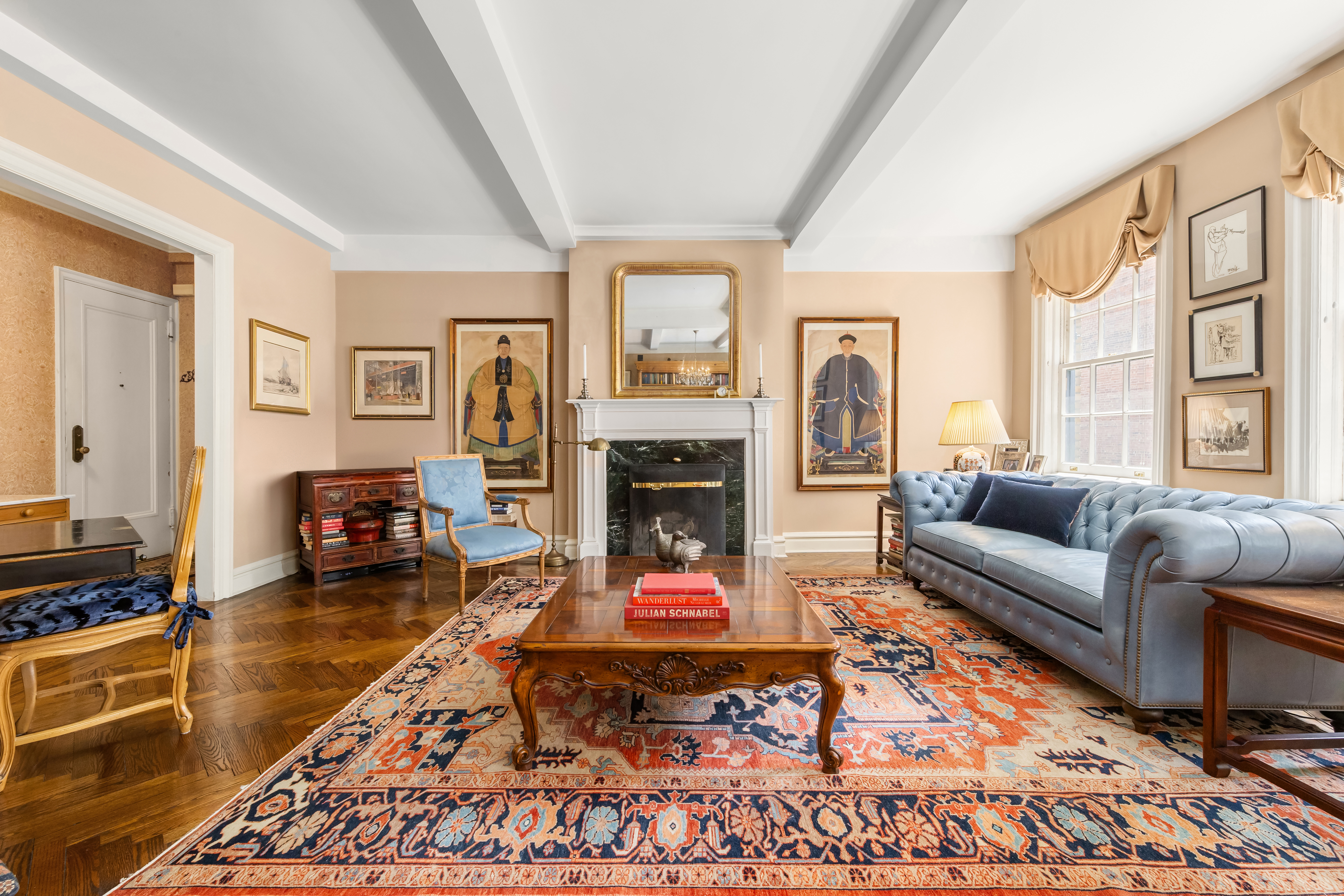 a living room with furniture windows and a fireplace