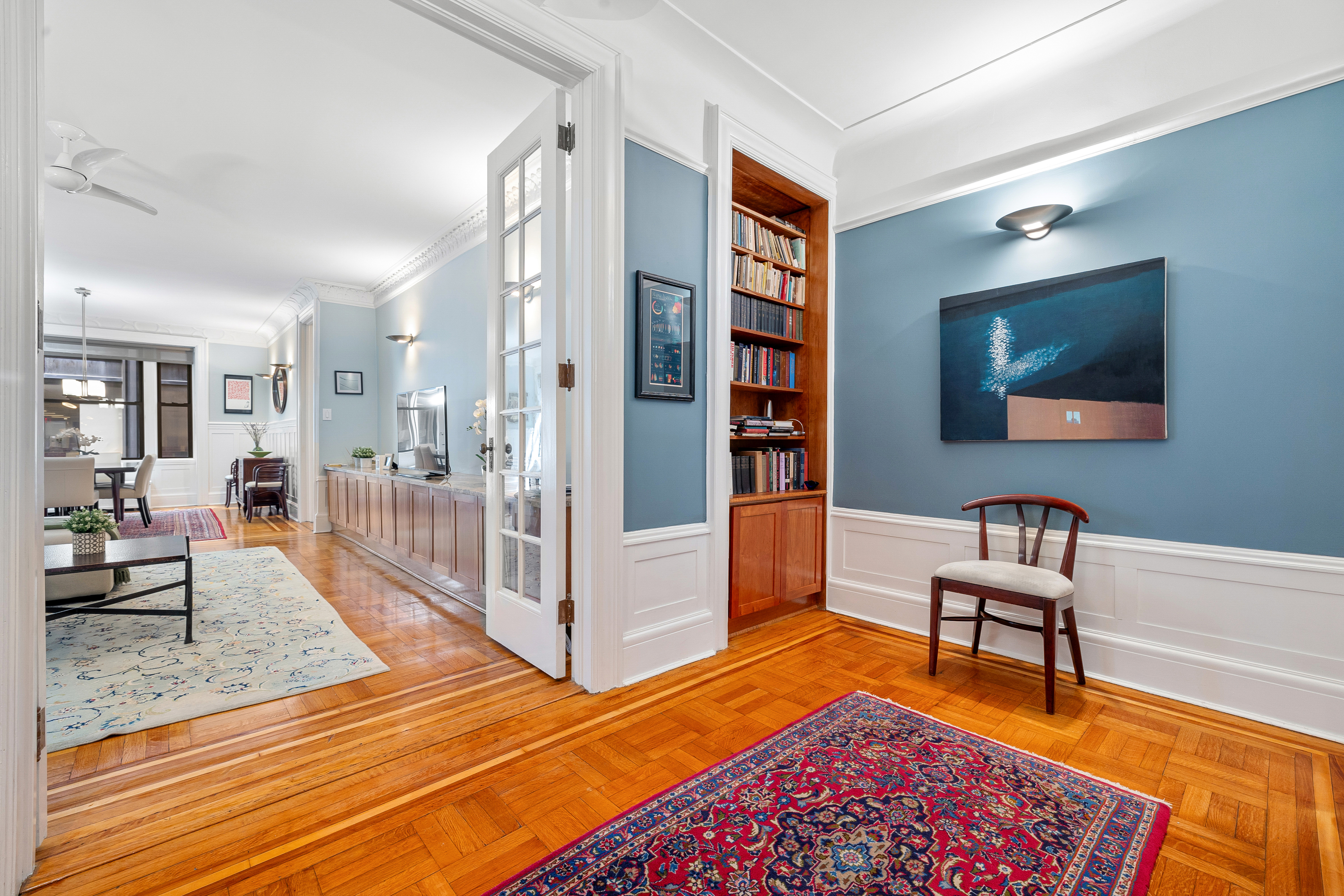 a bedroom with furniture and a rug