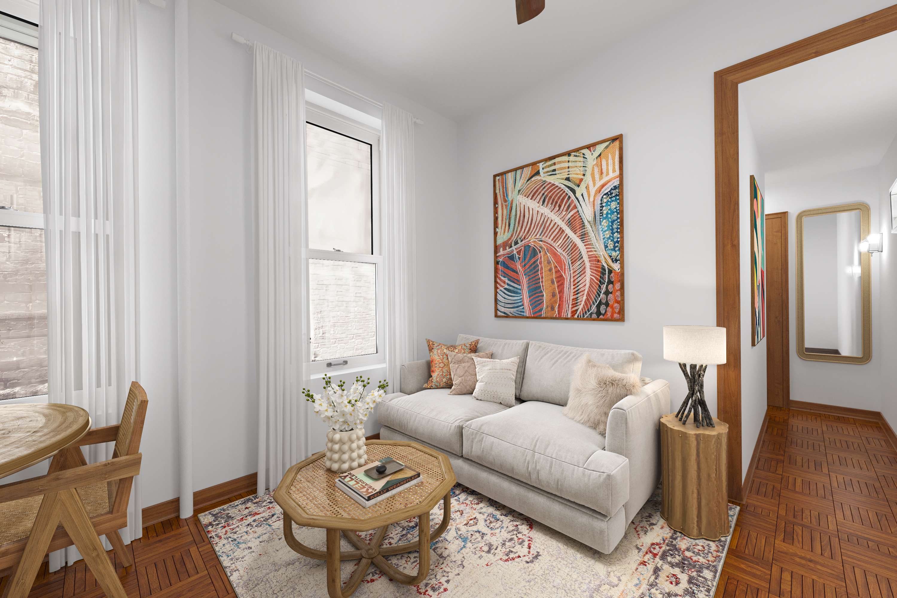 a living room with furniture and wooden floor