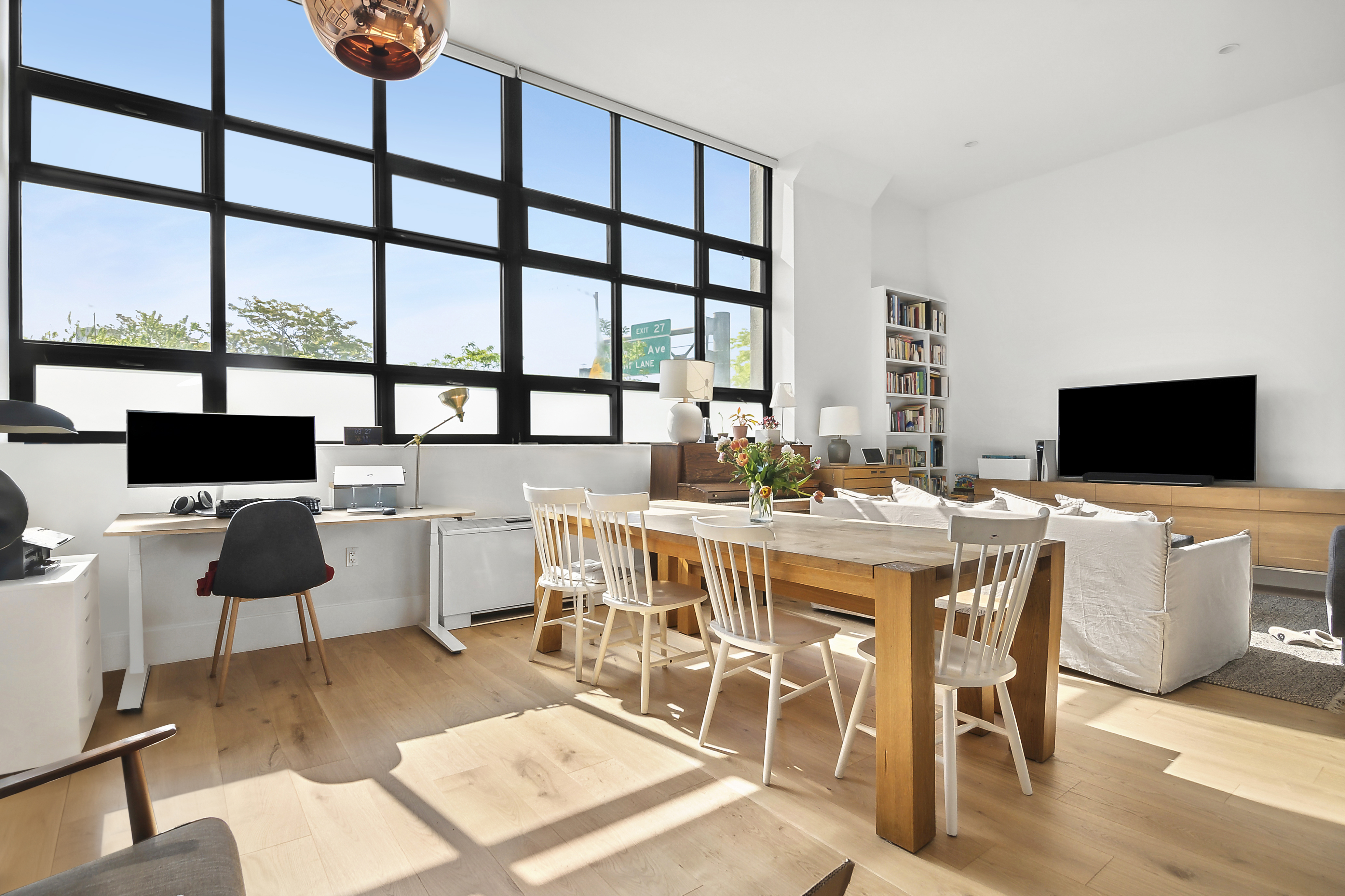 a view of a dining room with furniture window and outside view