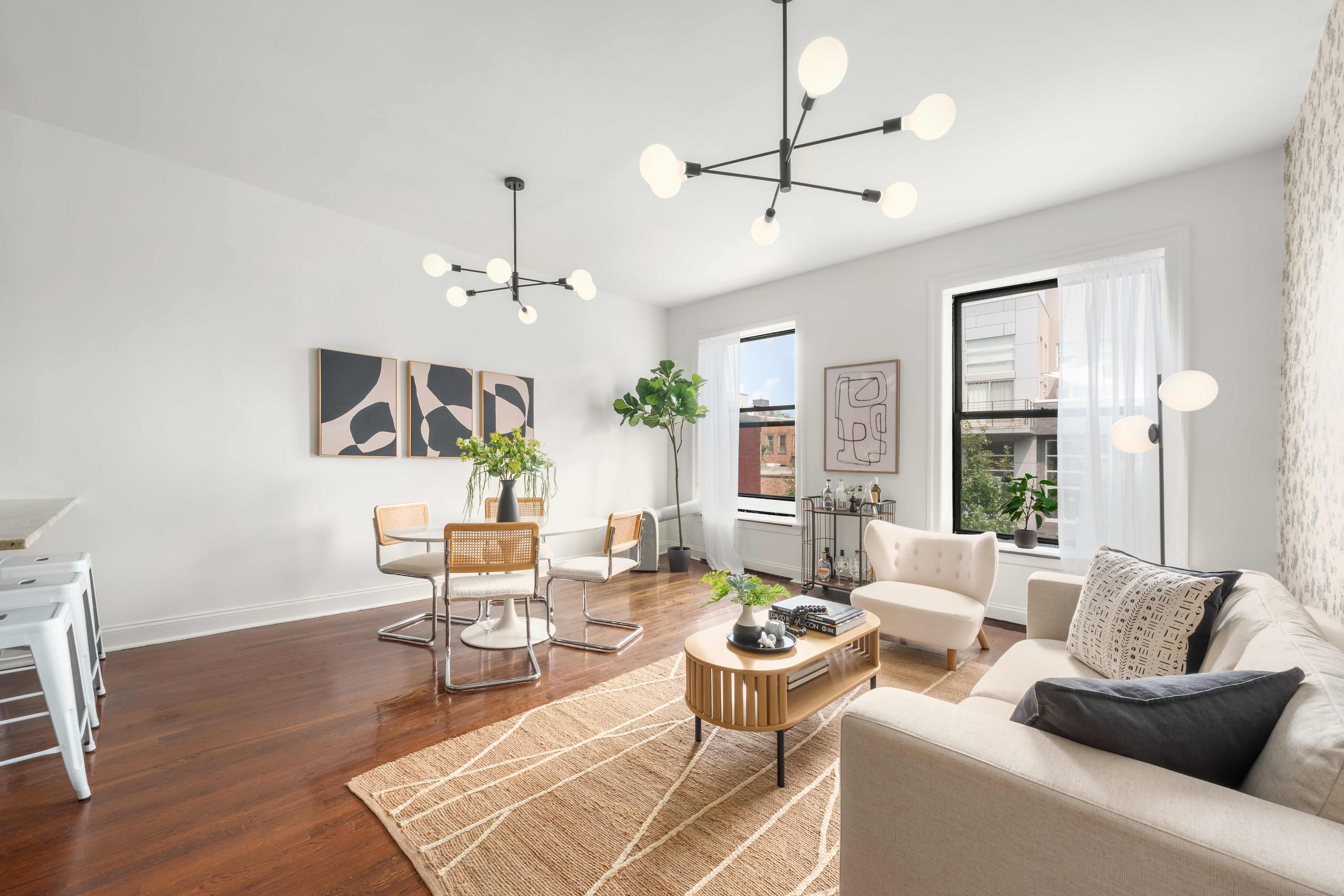 a living room with furniture a chandelier and a window