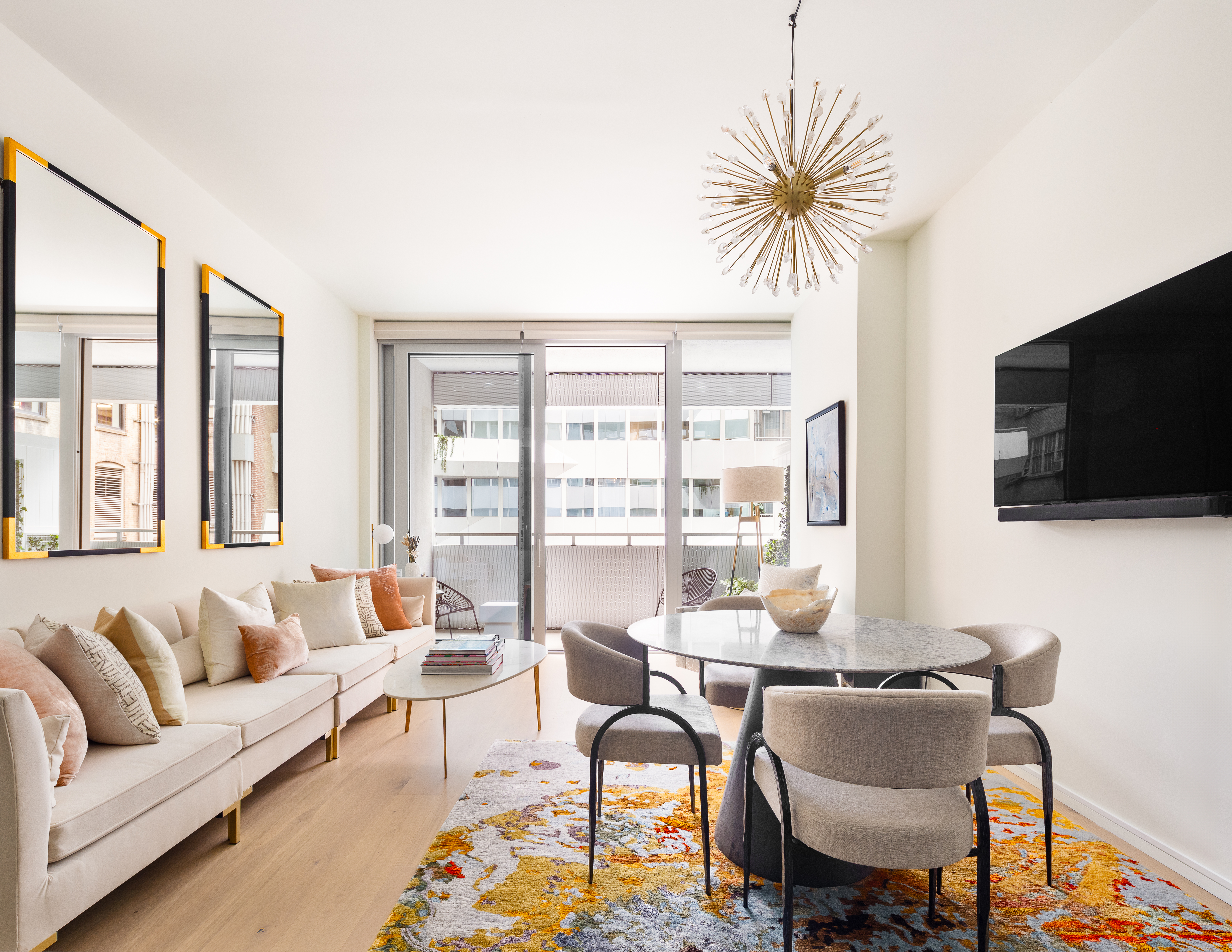 a living room with furniture and a flat screen tv