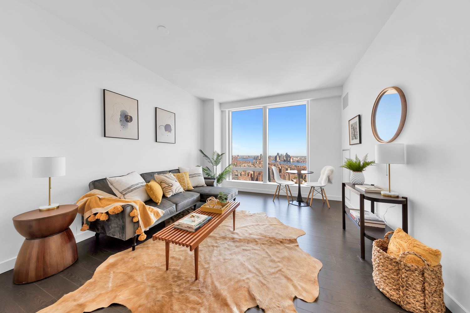 a living room with furniture a rug and a lamp