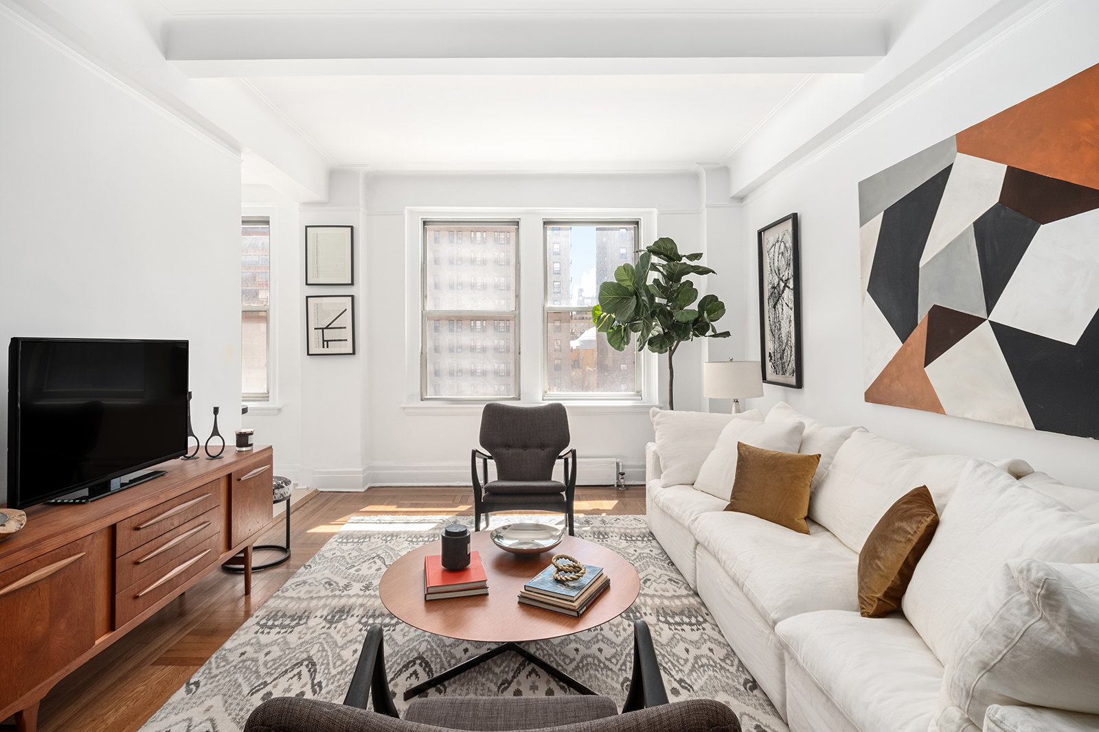 a living room with furniture and a flat screen tv