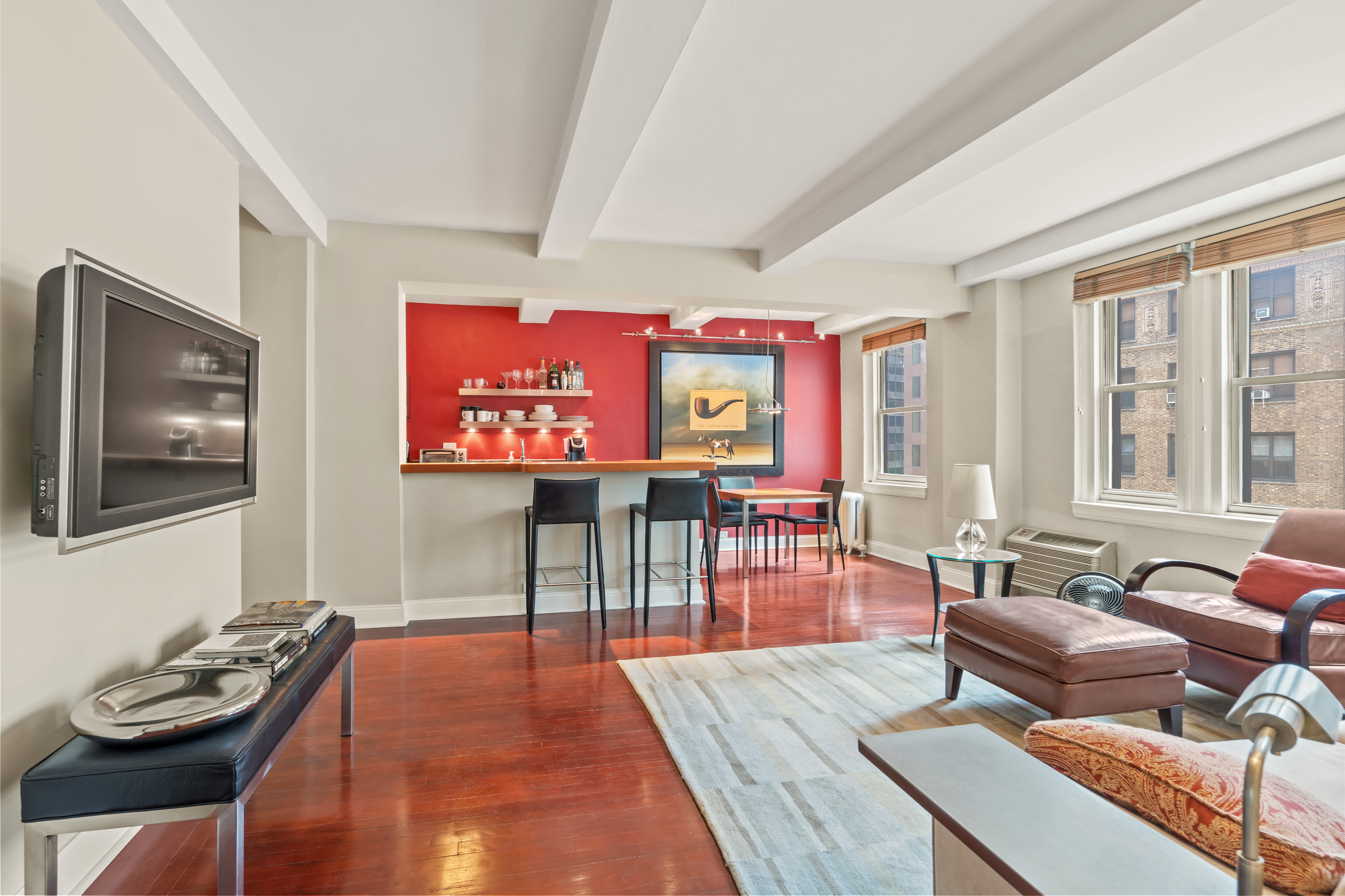 a living room with furniture and a flat screen tv