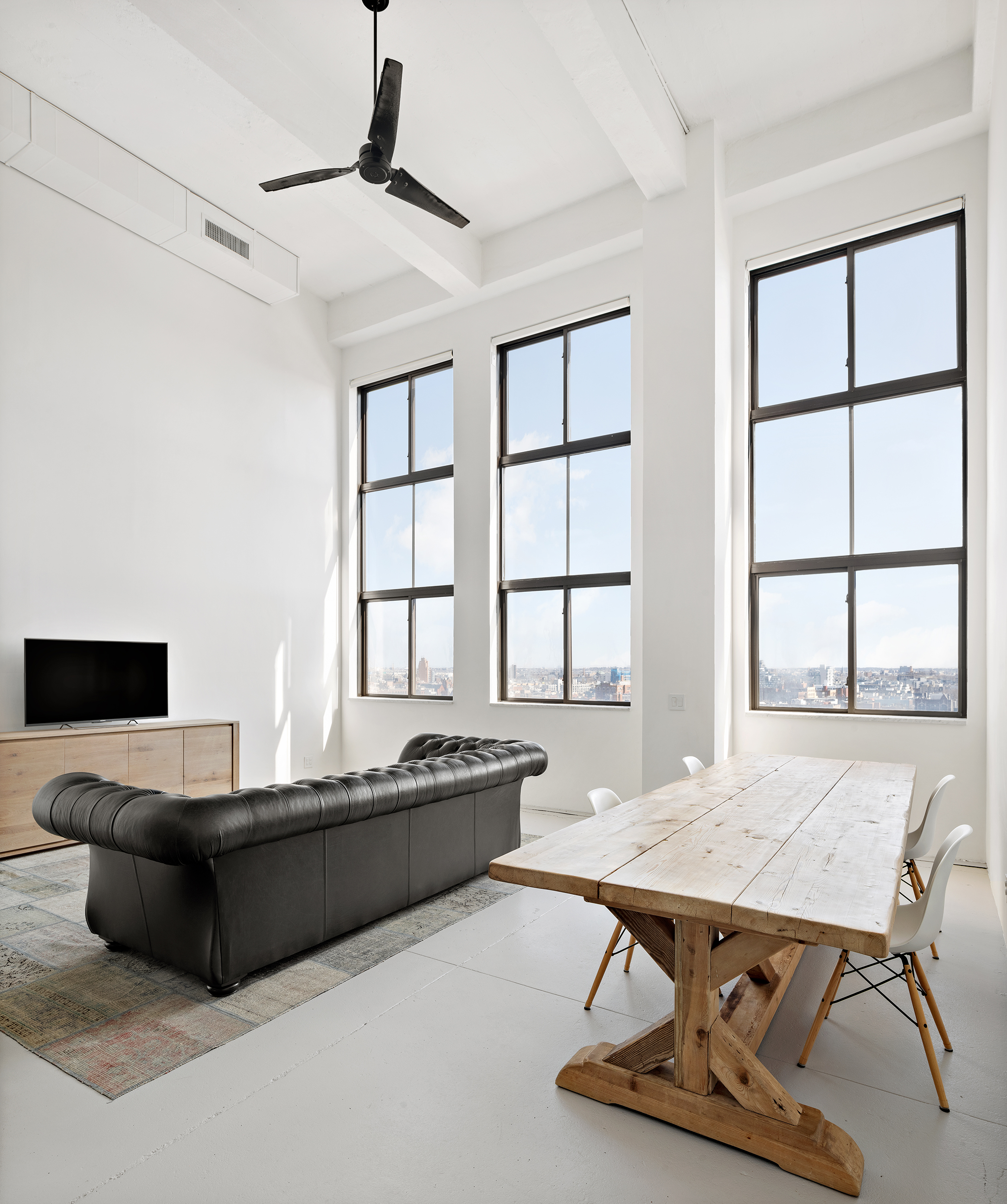 a living room with furniture pool table and flat screen tv