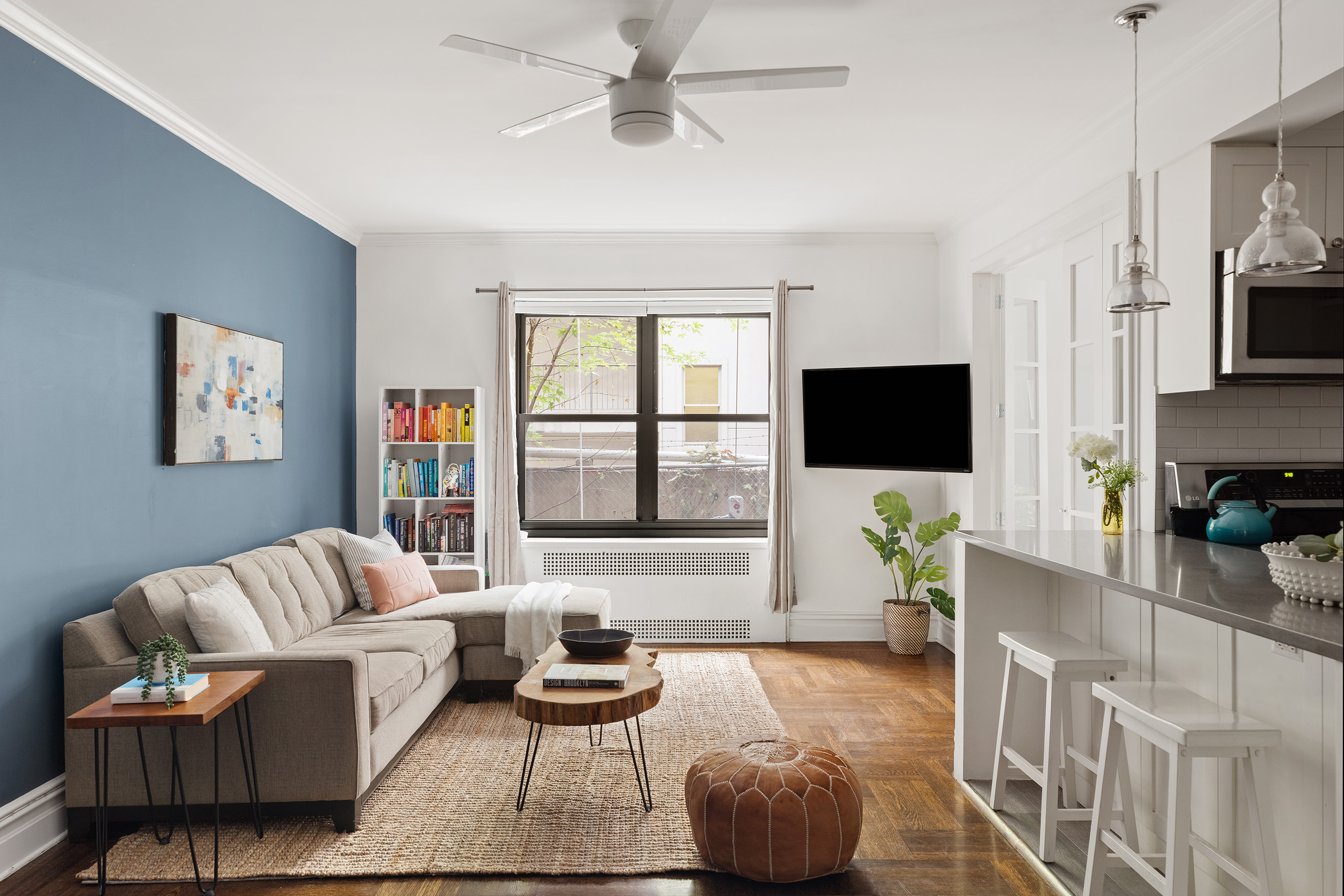 a living room with furniture and a flat screen tv