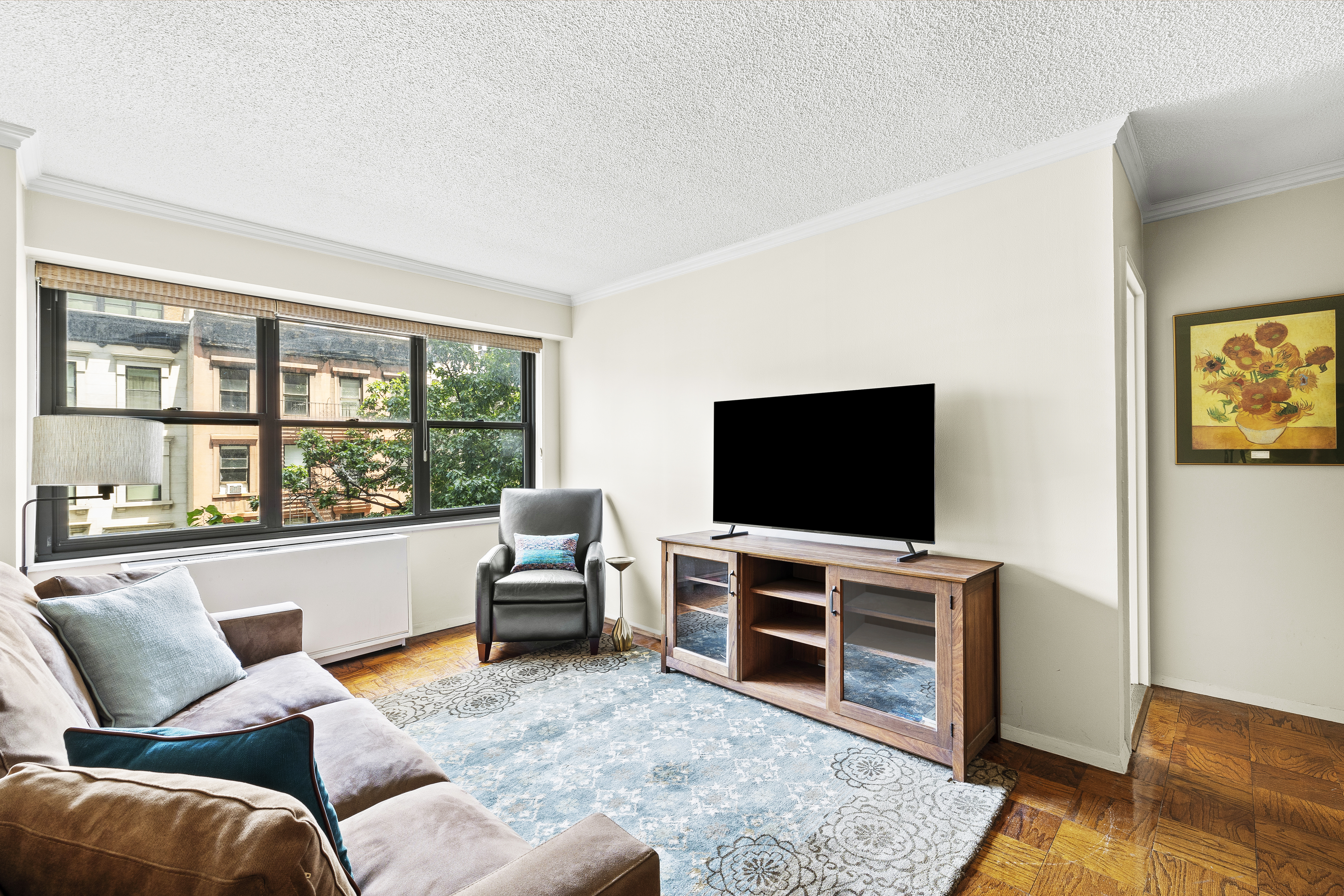 a living room with furniture and a flat screen tv