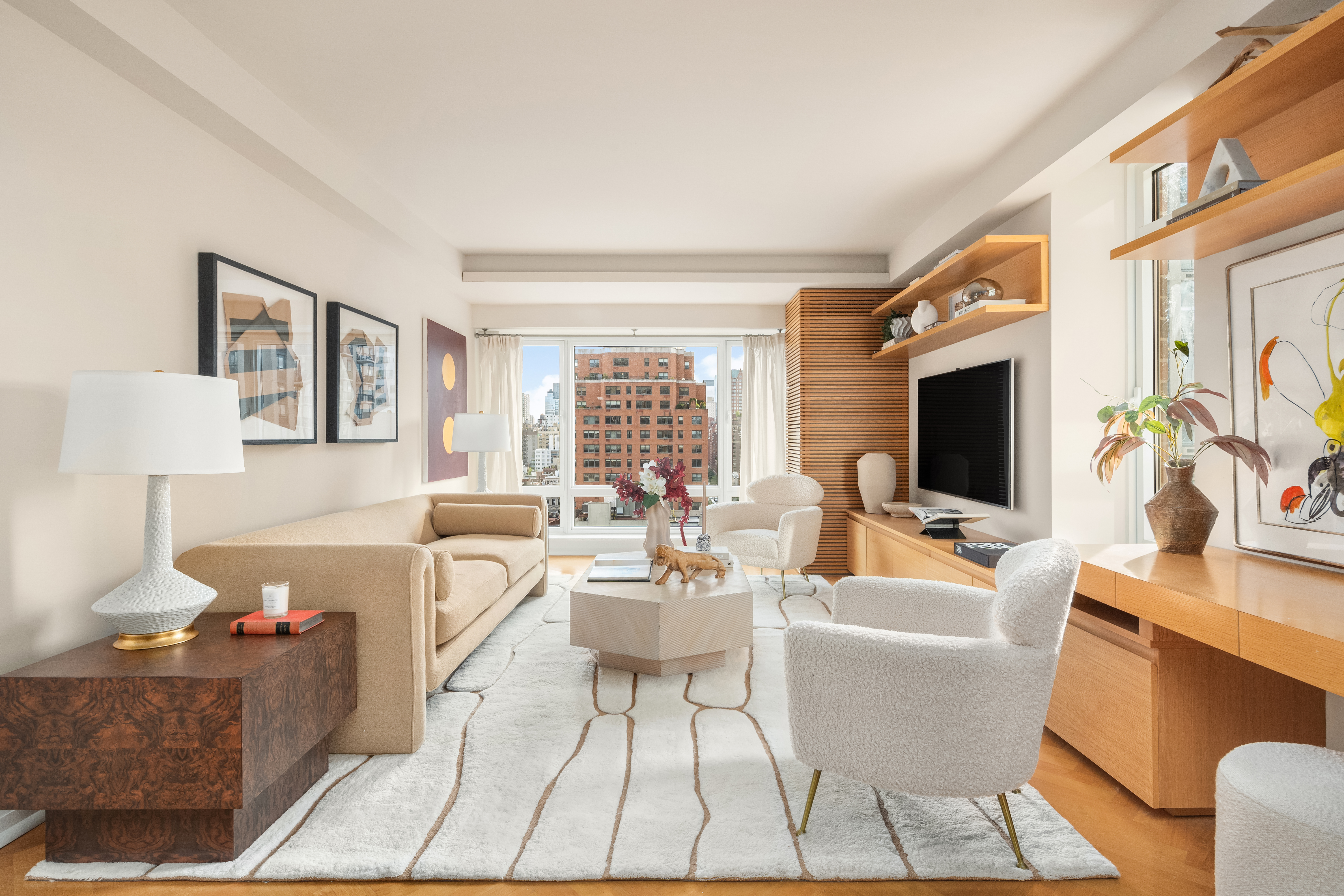 a living room with fireplace furniture and a flat screen tv