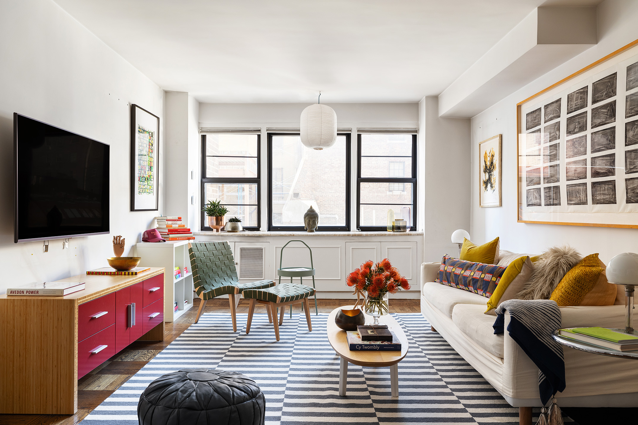 a living room with furniture and a flat screen tv