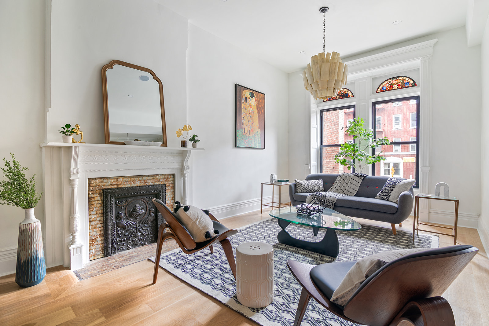 a living room with furniture and a fireplace