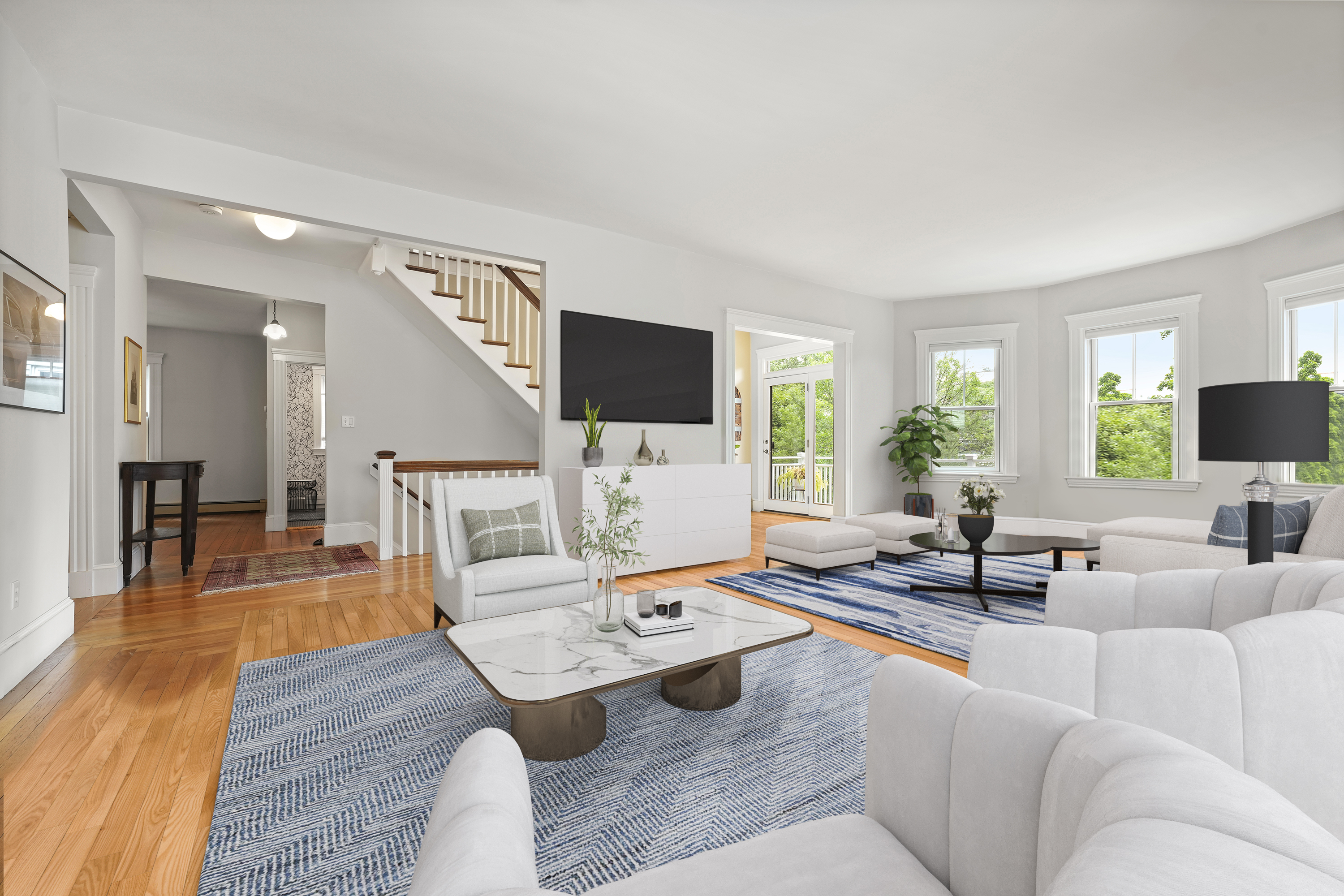 a living room with furniture and a flat screen tv