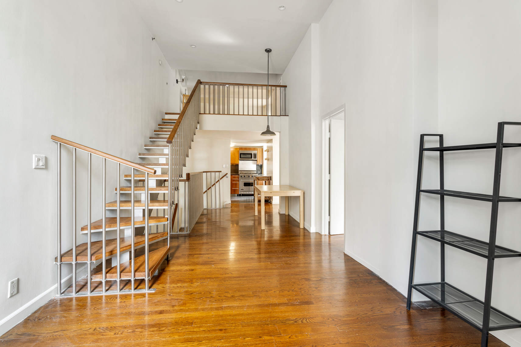 a view of livingroom and hardwood floor