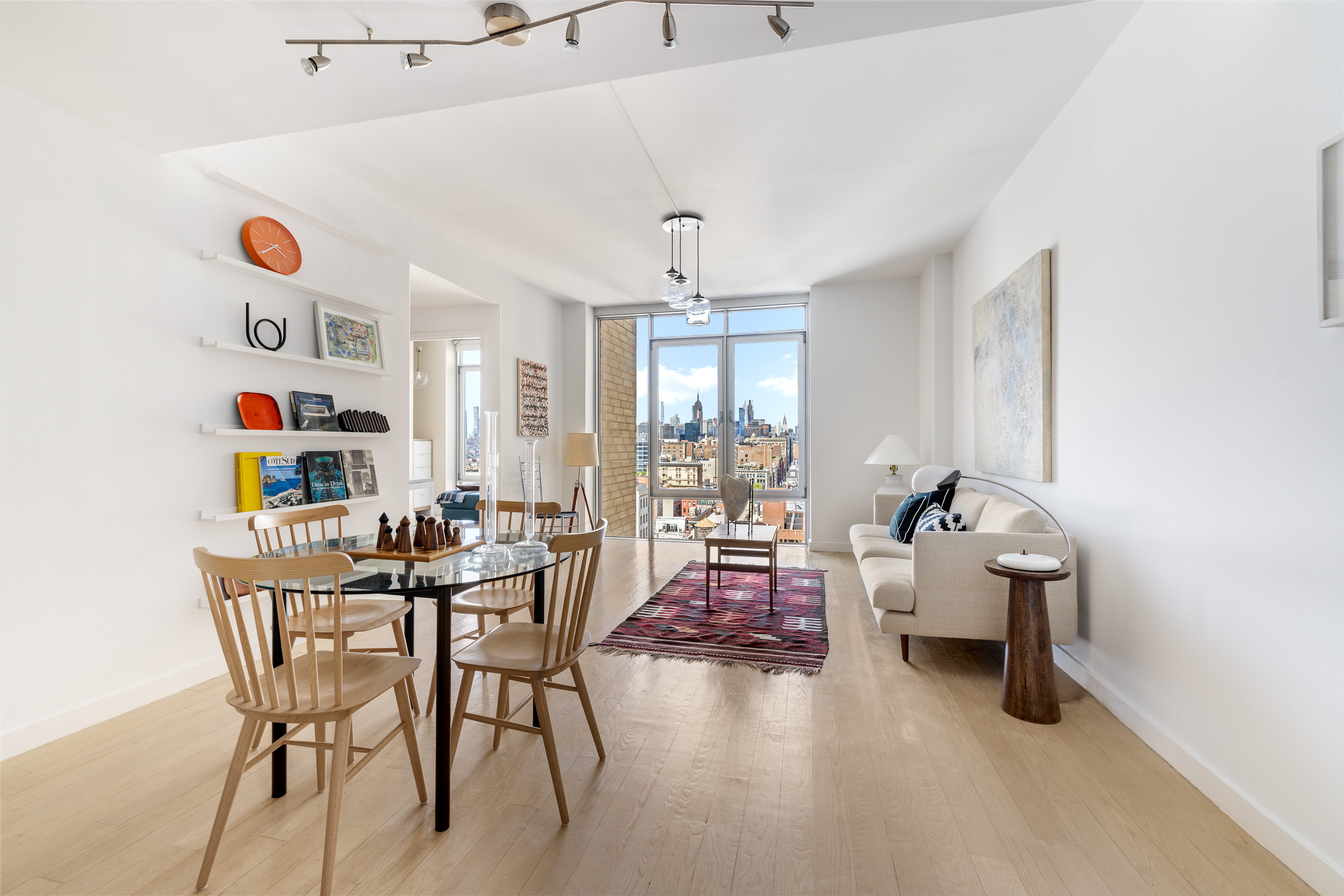 a dining room with furniture and wooden floor