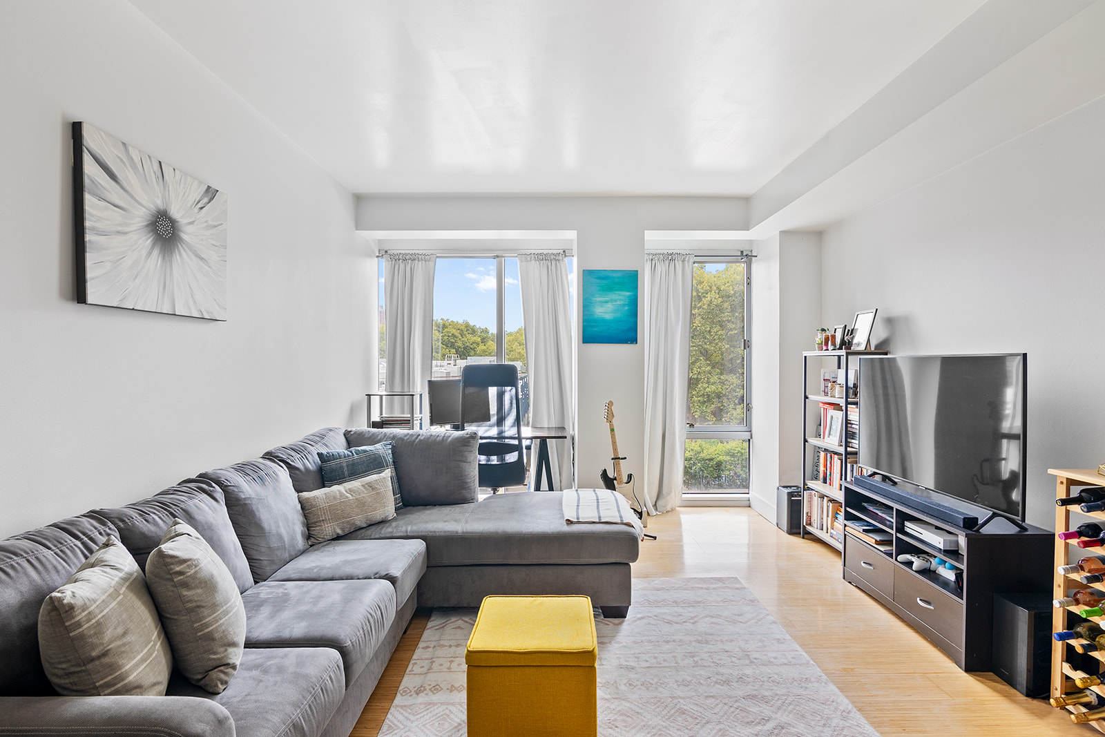 a living room with furniture and a flat screen tv