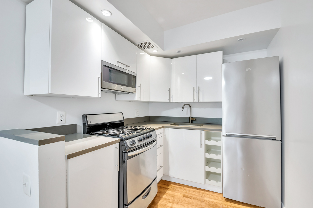 a kitchen with a stove microwave and refrigerator