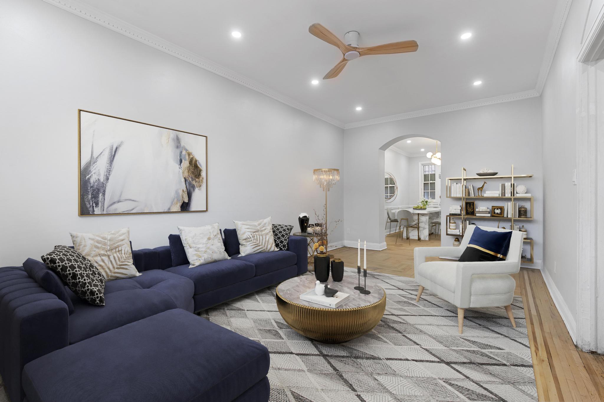 a living room with furniture and a painting