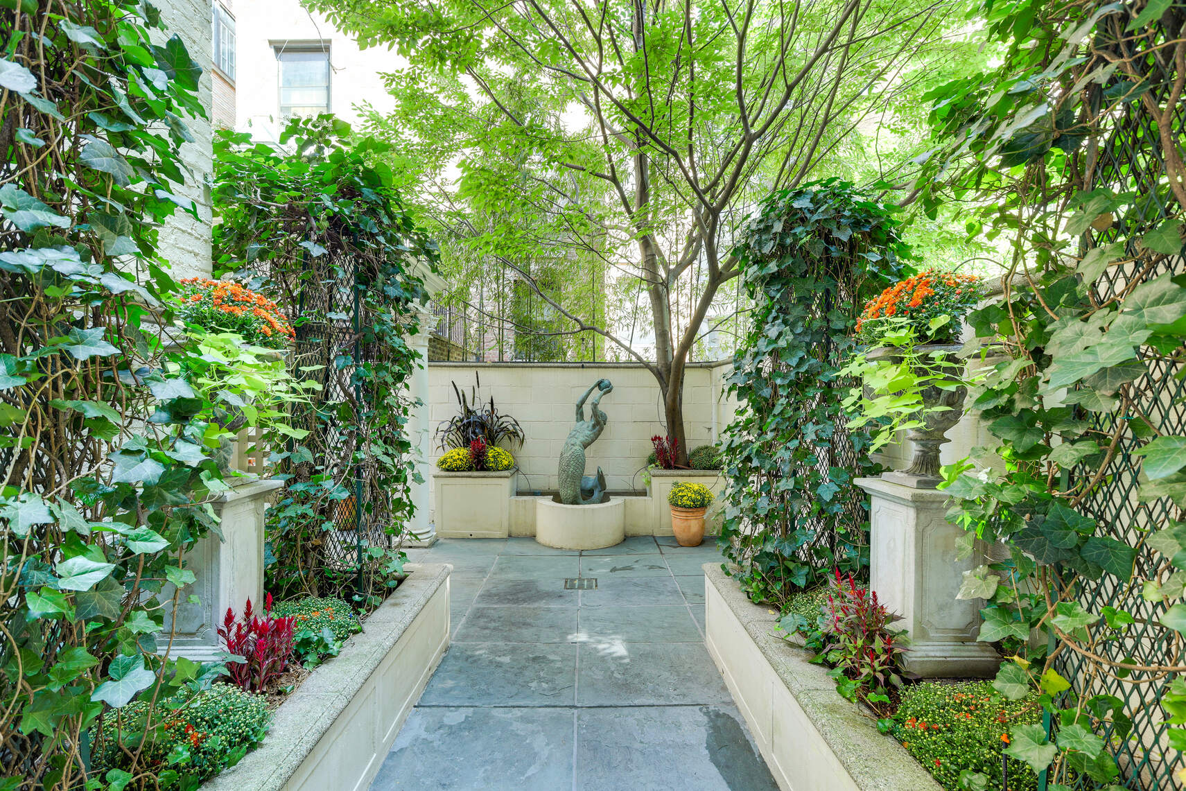 a view of a garden with sitting area