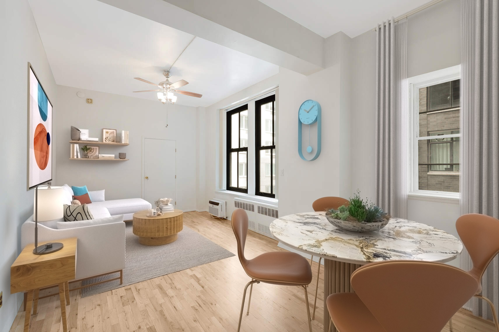 a dining room with furniture a window and wooden floor