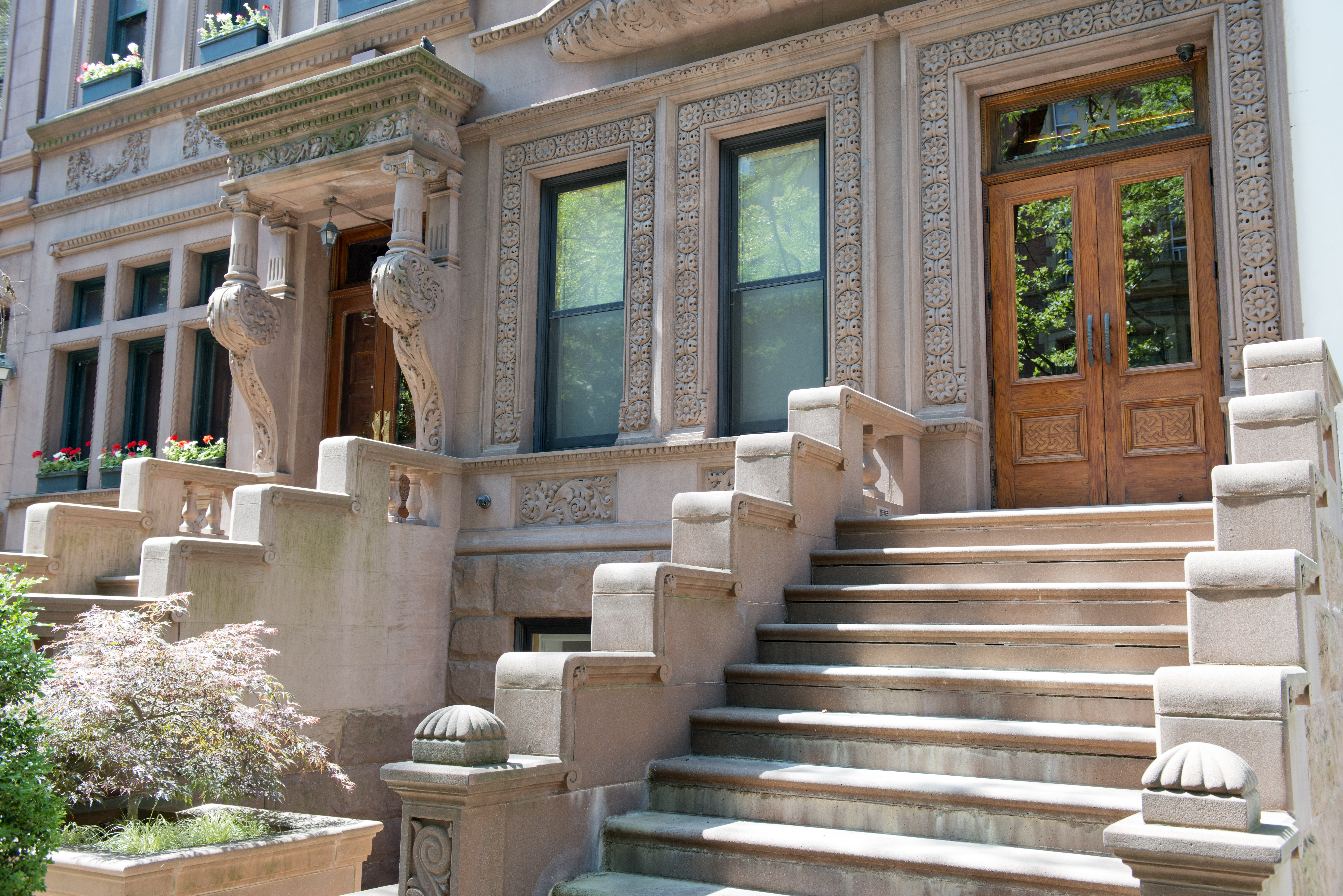 a front view of a house with outdoor seating