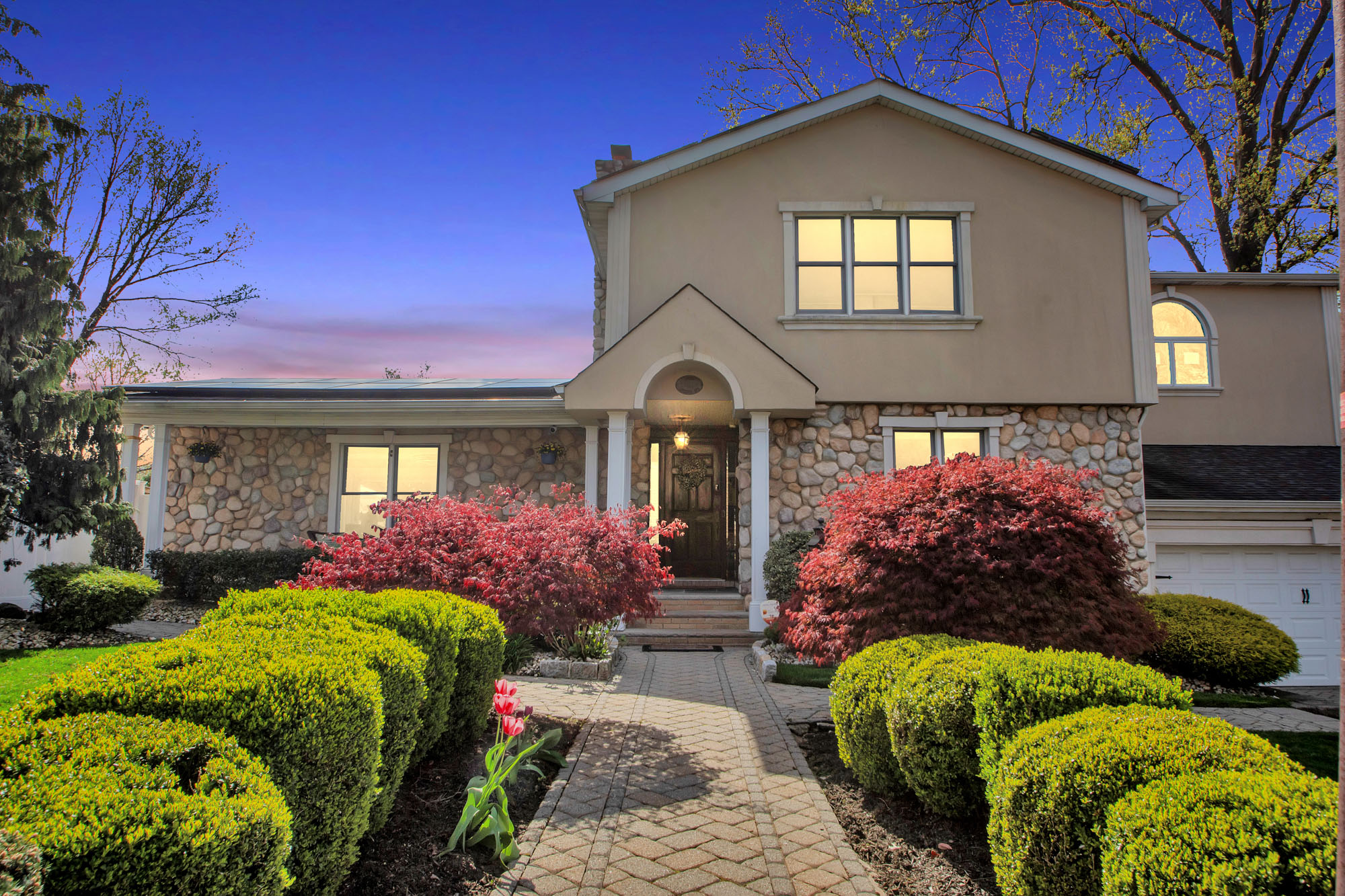 a front view of a house with a yard