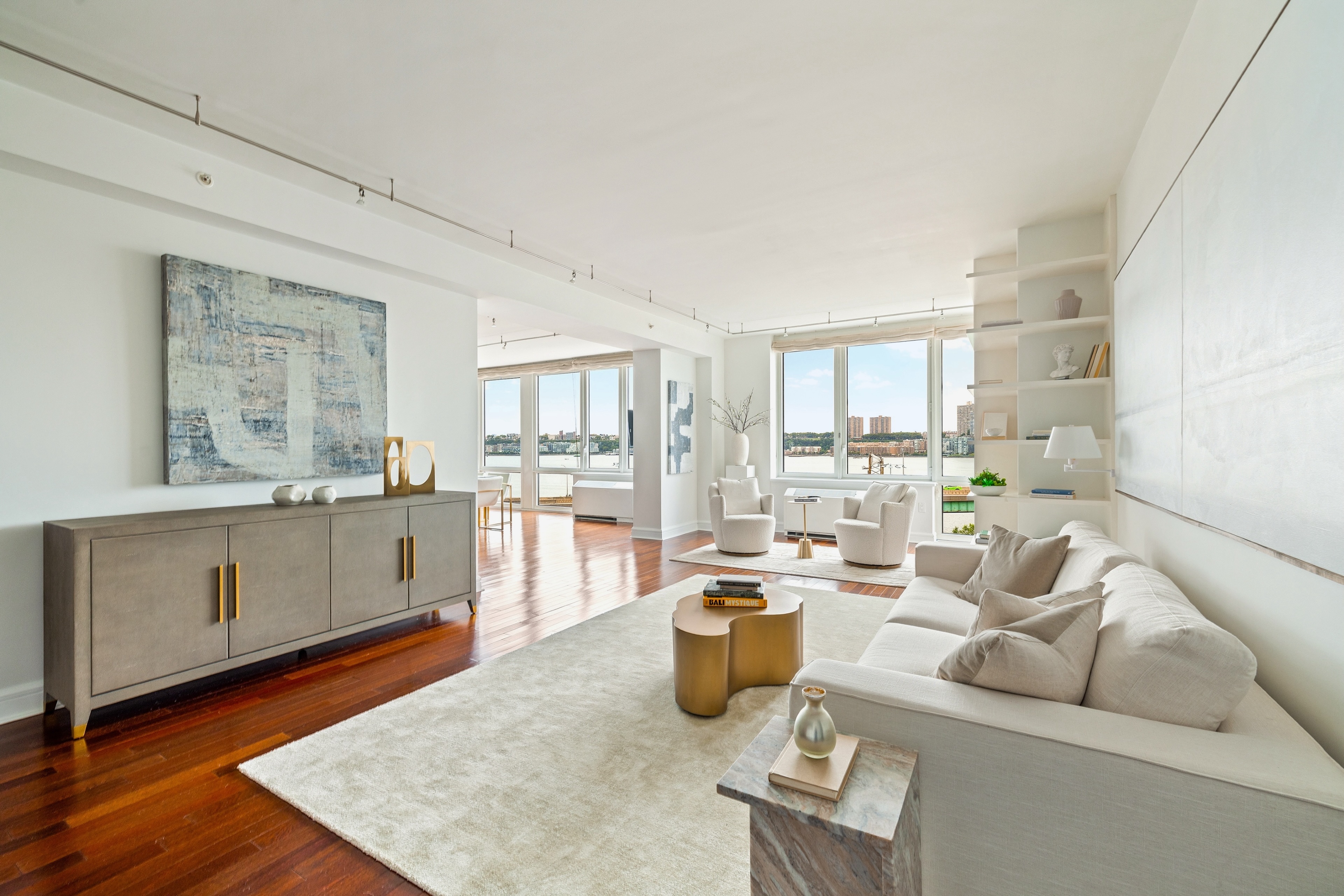 a living room with furniture and kitchen view