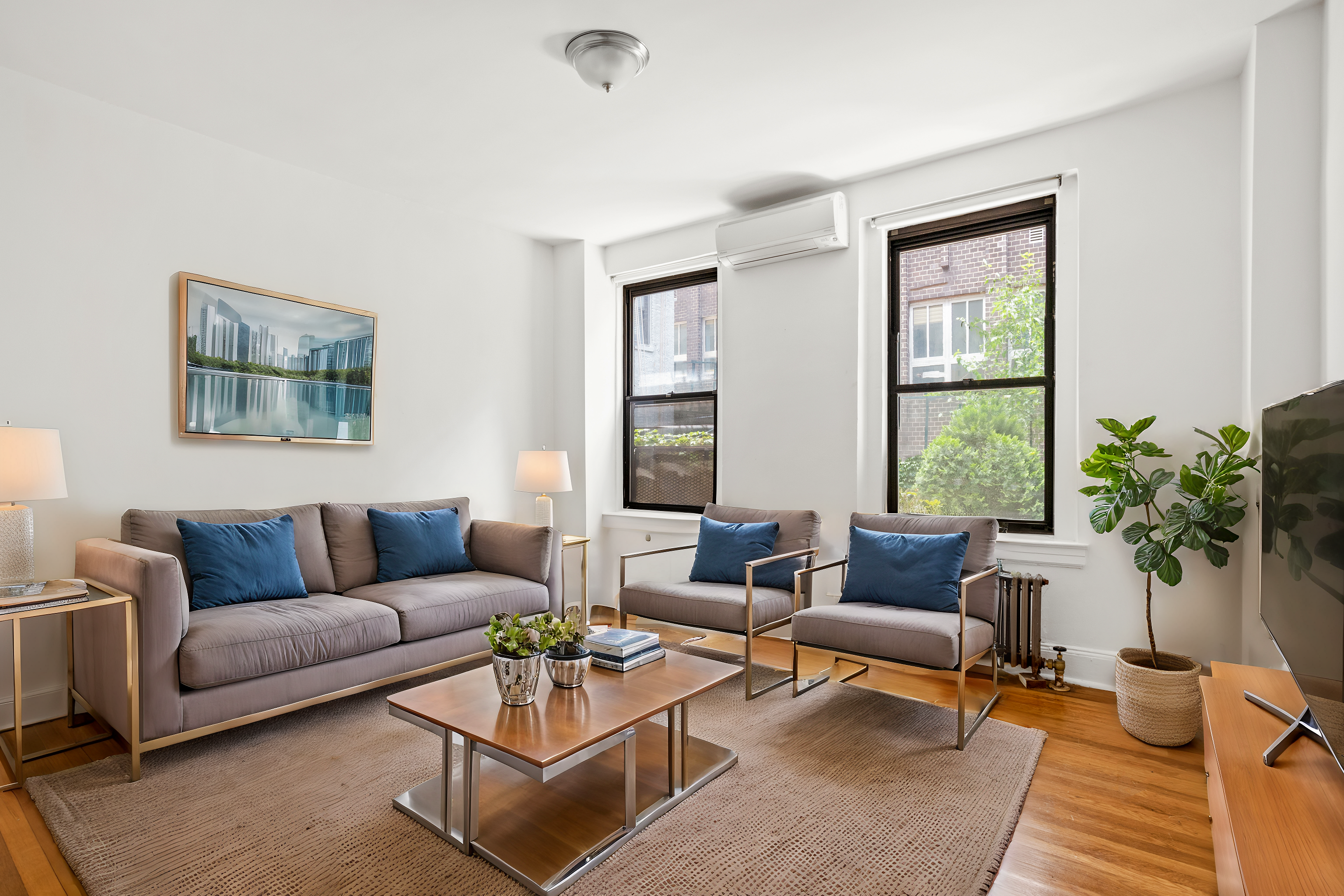 a living room with furniture and a large window