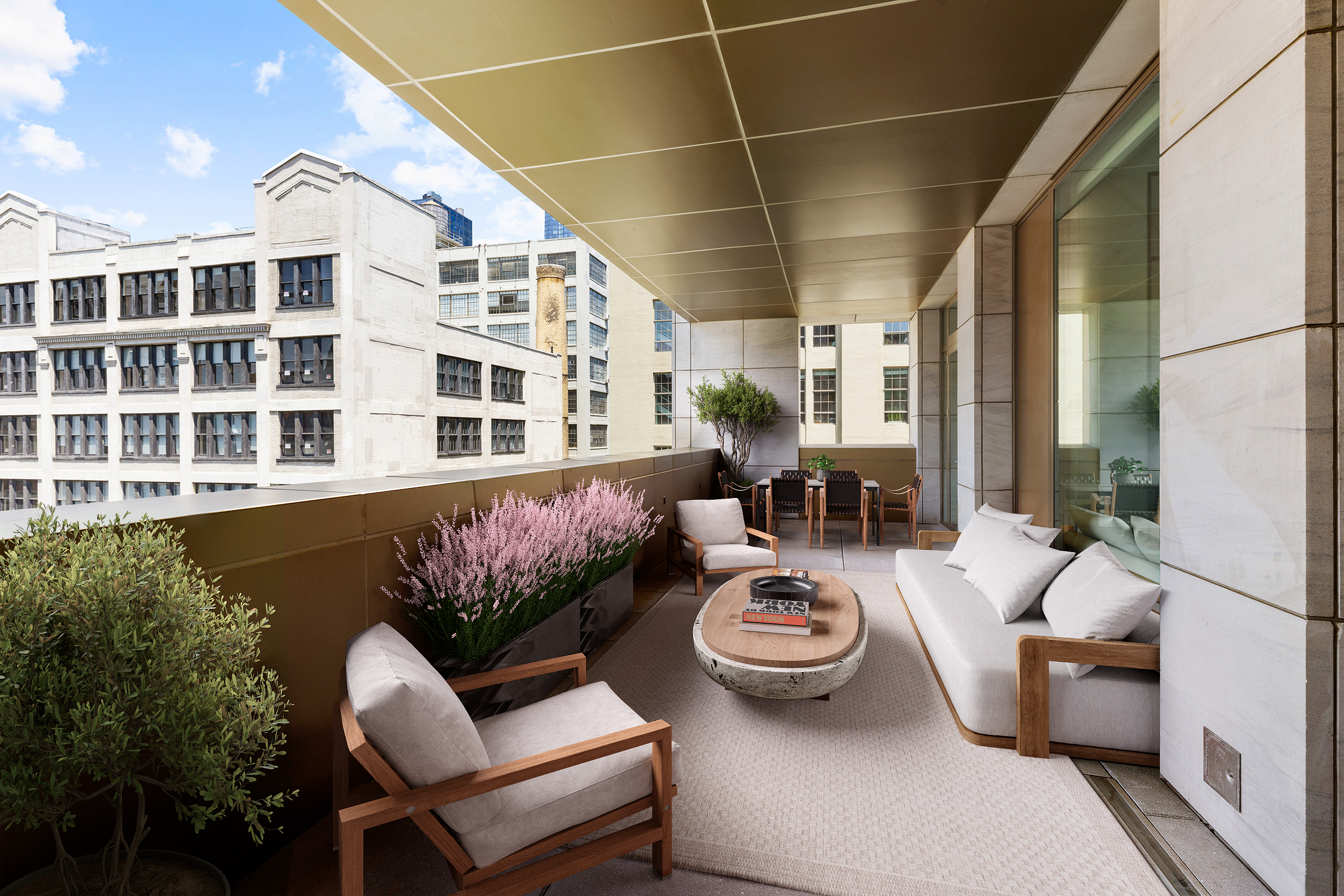 a view of a patio with couches table and chairs and potted plants