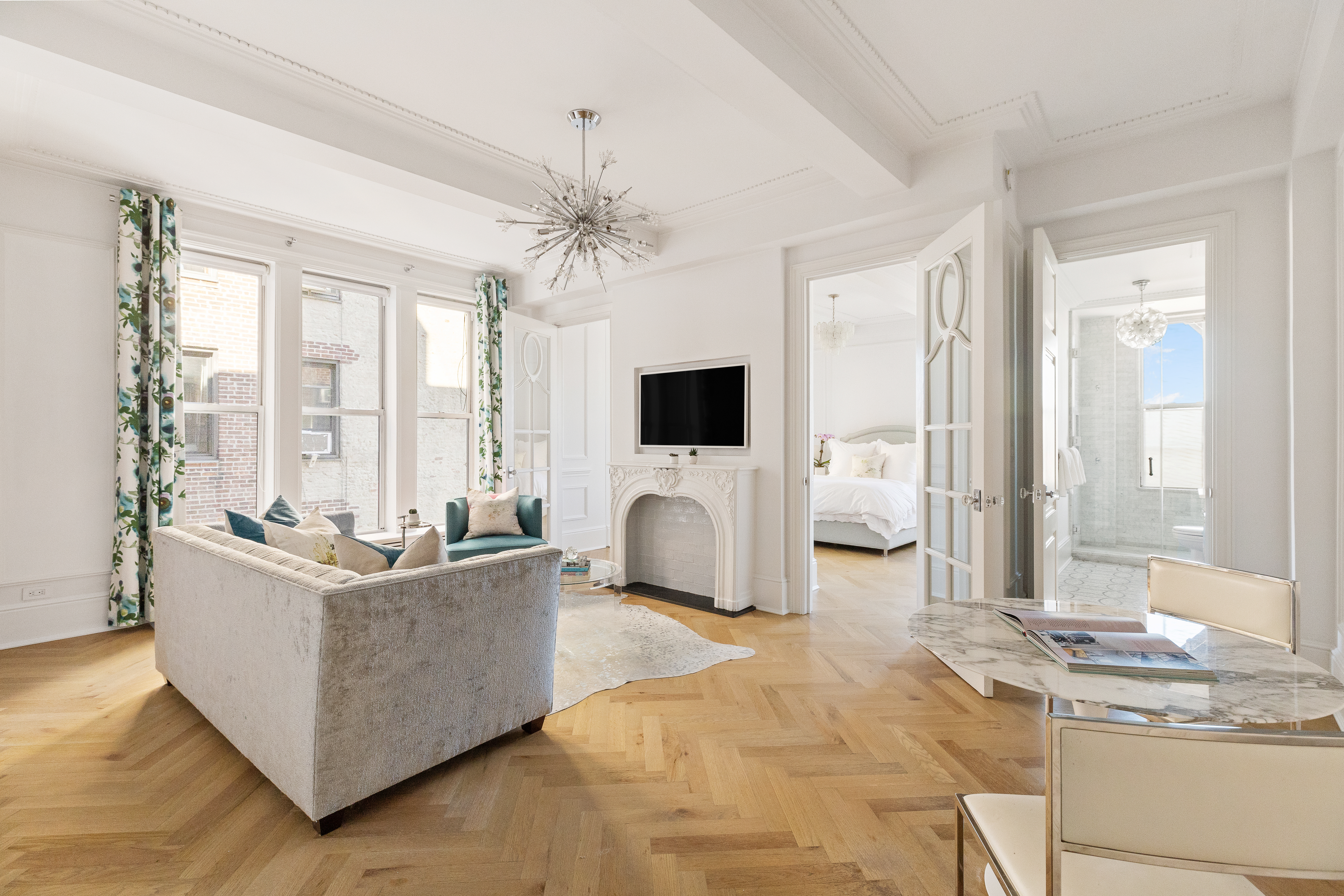 a living room with furniture and flat screen tv