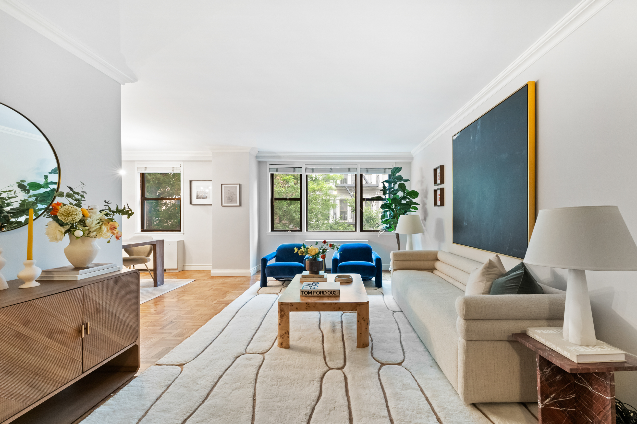 a living room with furniture and wooden floor