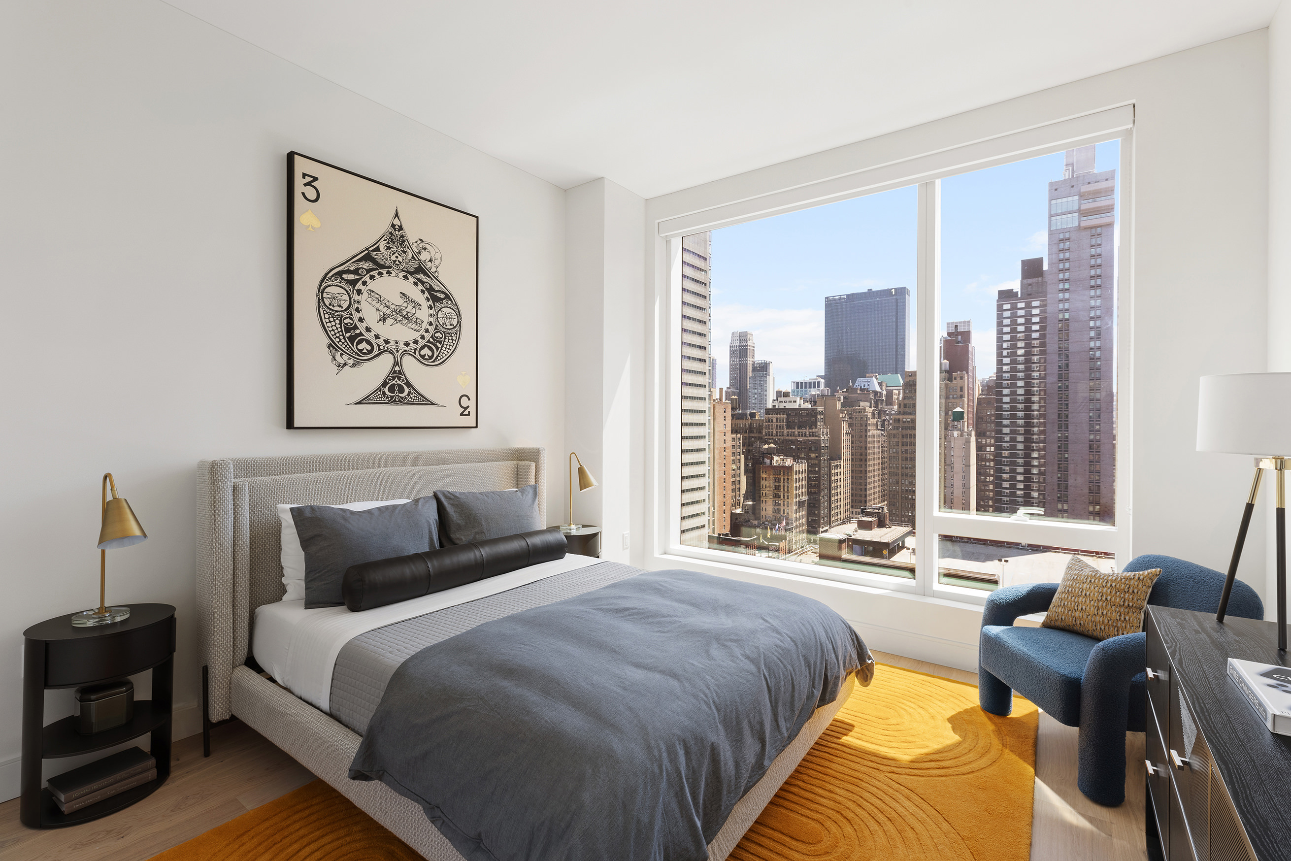 a bedroom with bed and glass windows