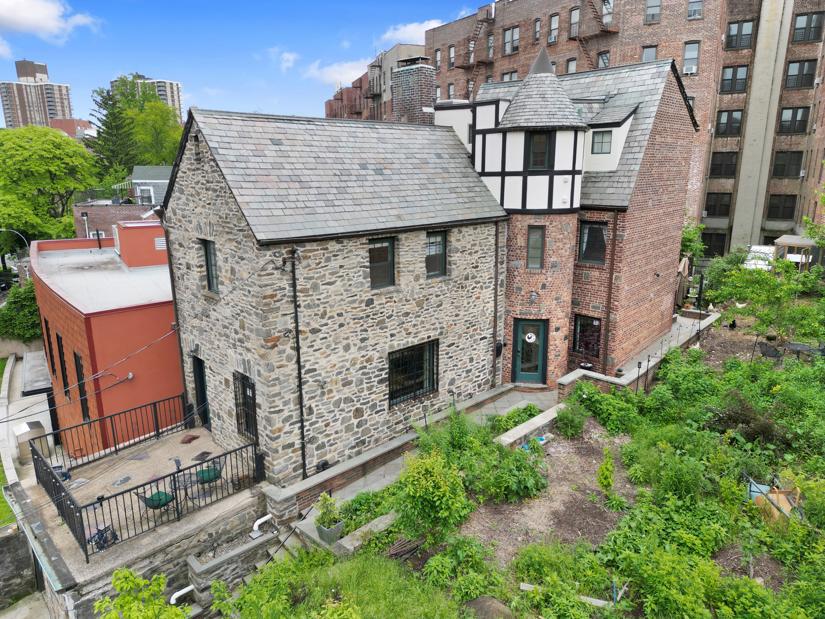 an aerial view of a house with a garden and plants