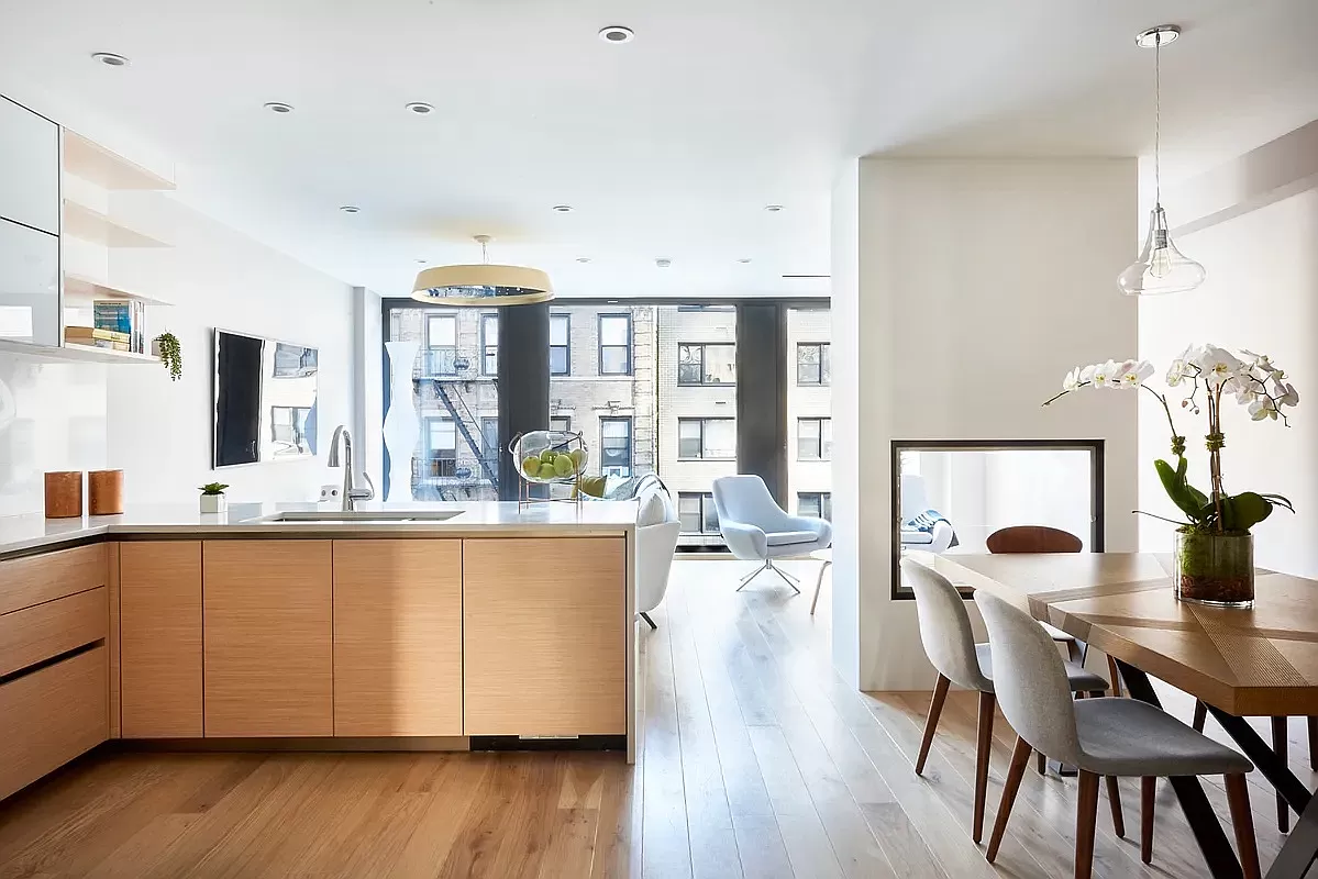 a dining room with furniture and wooden floor