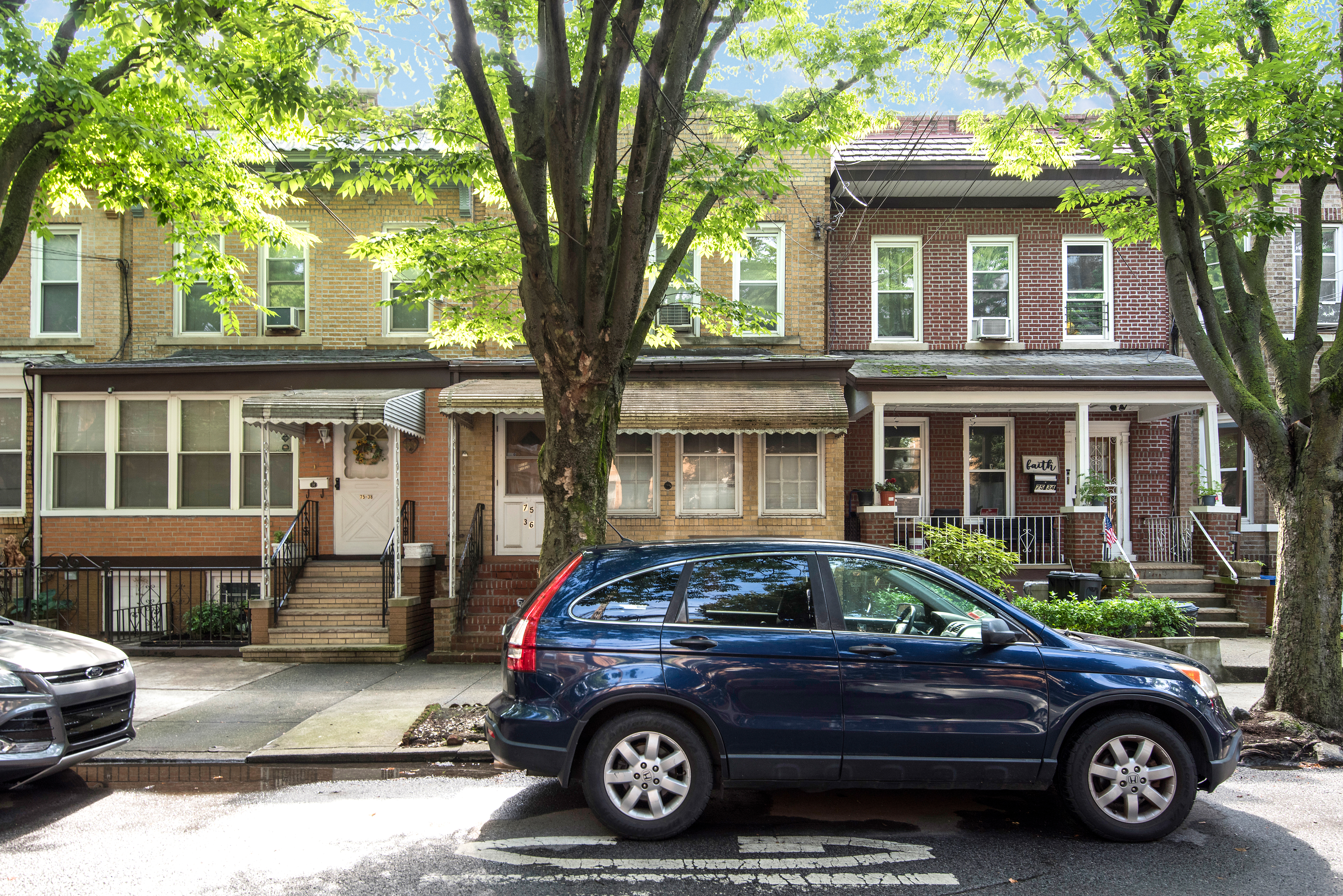 a car parked in front of a house