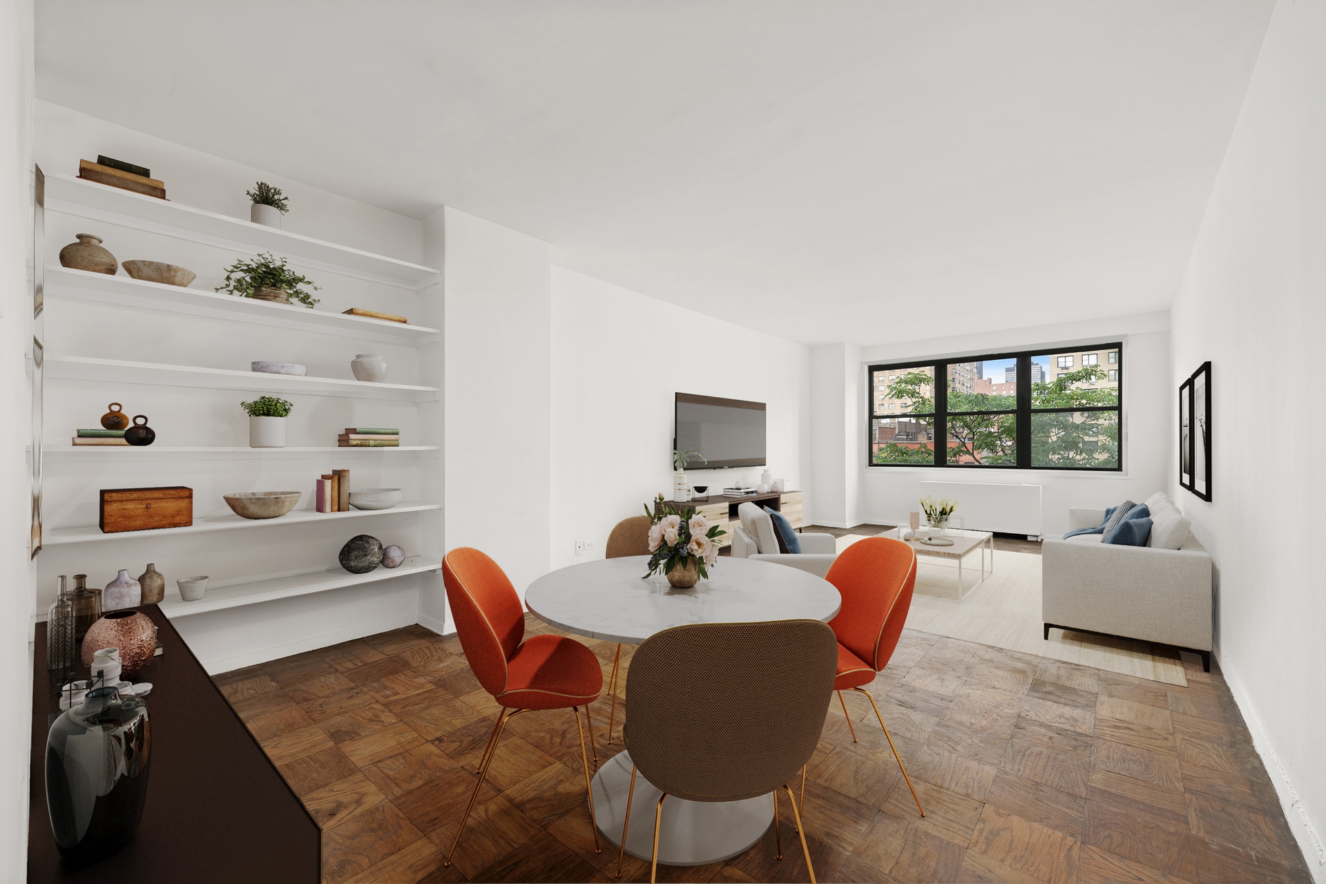 a dining room with furniture and a window