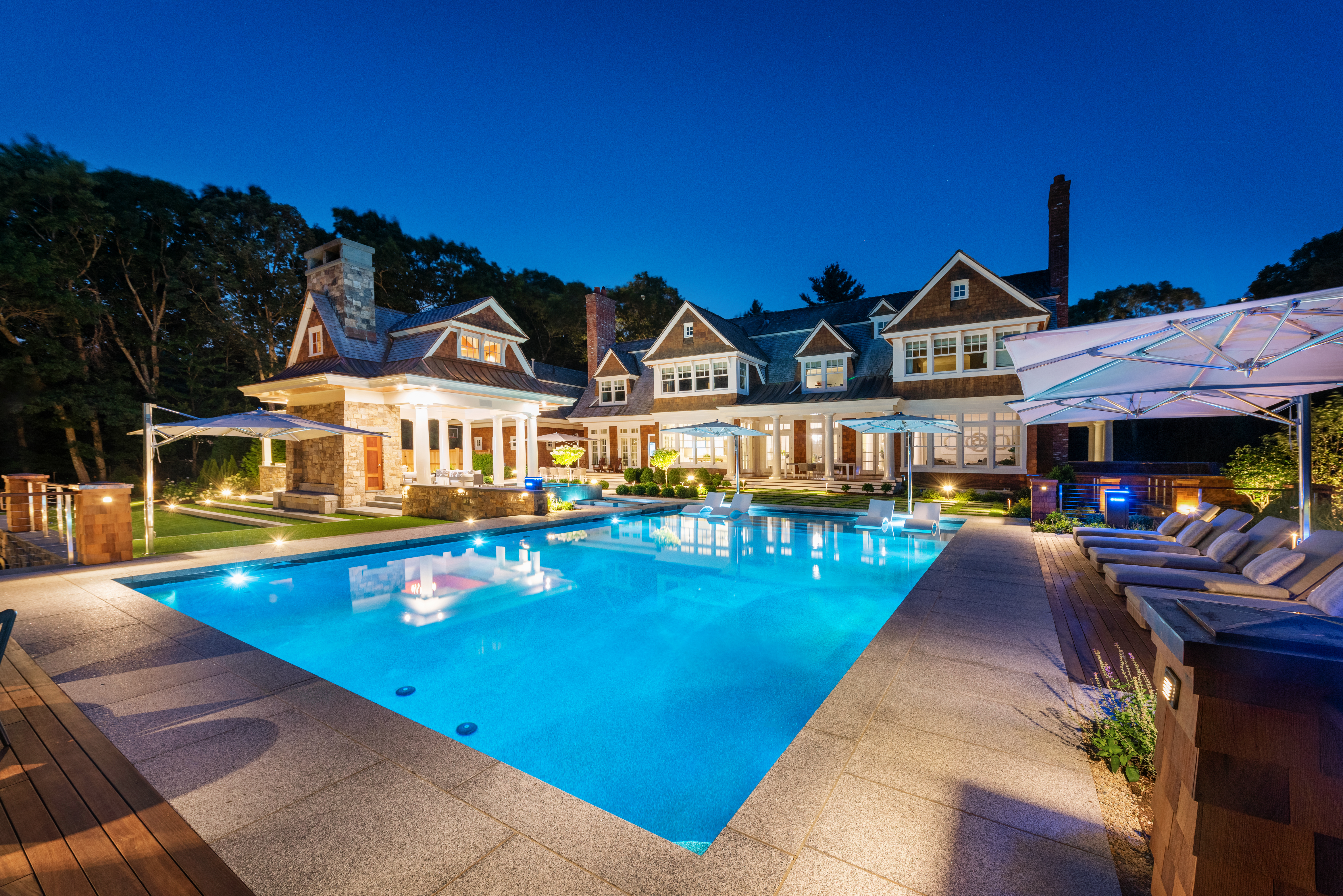 a view of a house with swimming pool and porch