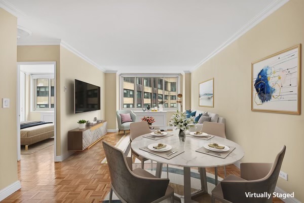 a view of a dining room with furniture window and wooden floor