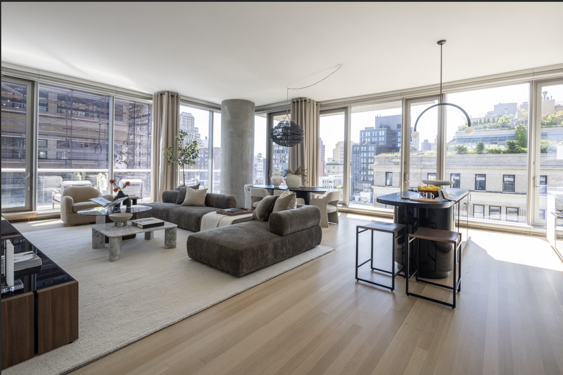 a living room with furniture and large windows