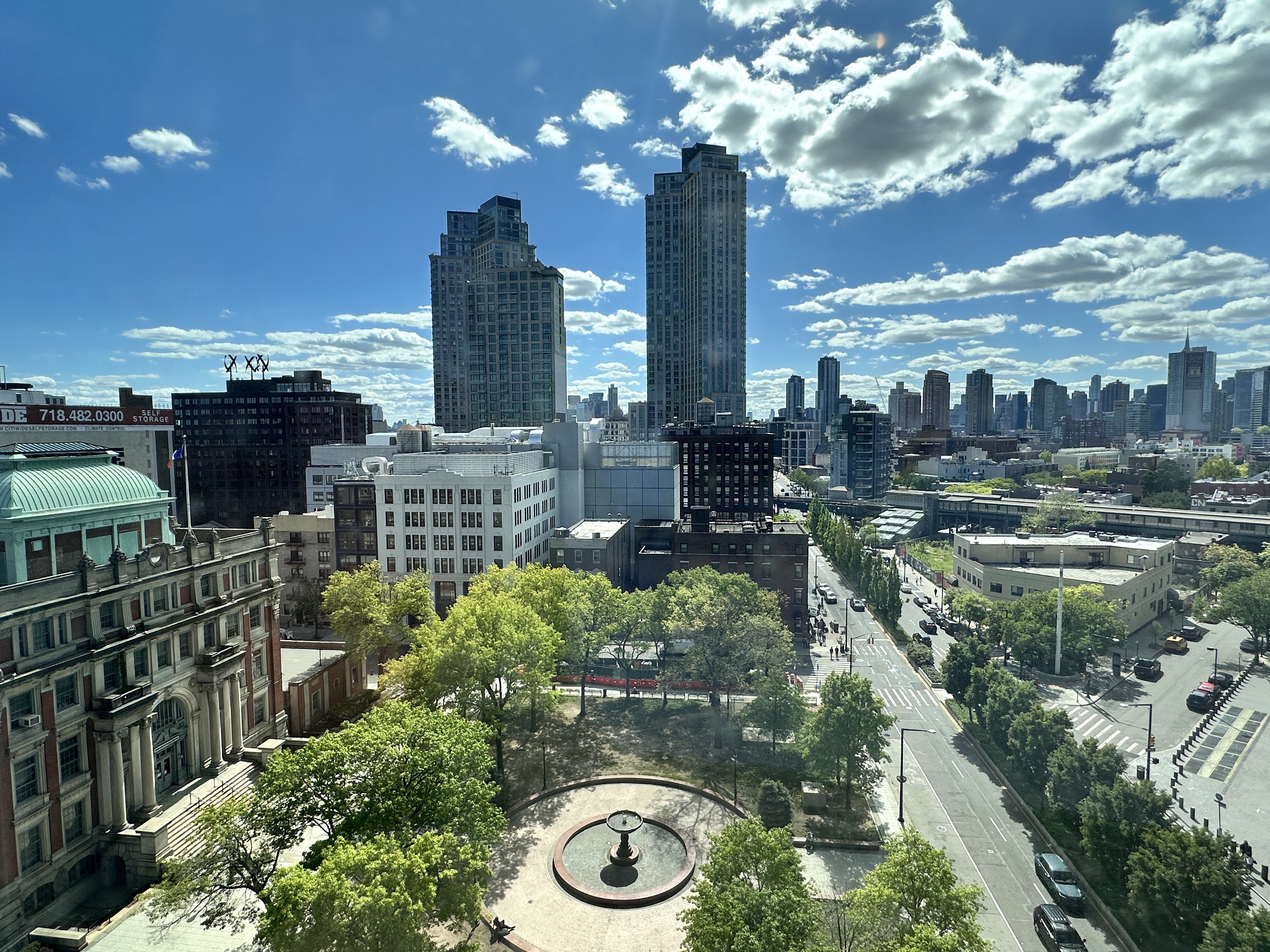 a view of a city with tall buildings