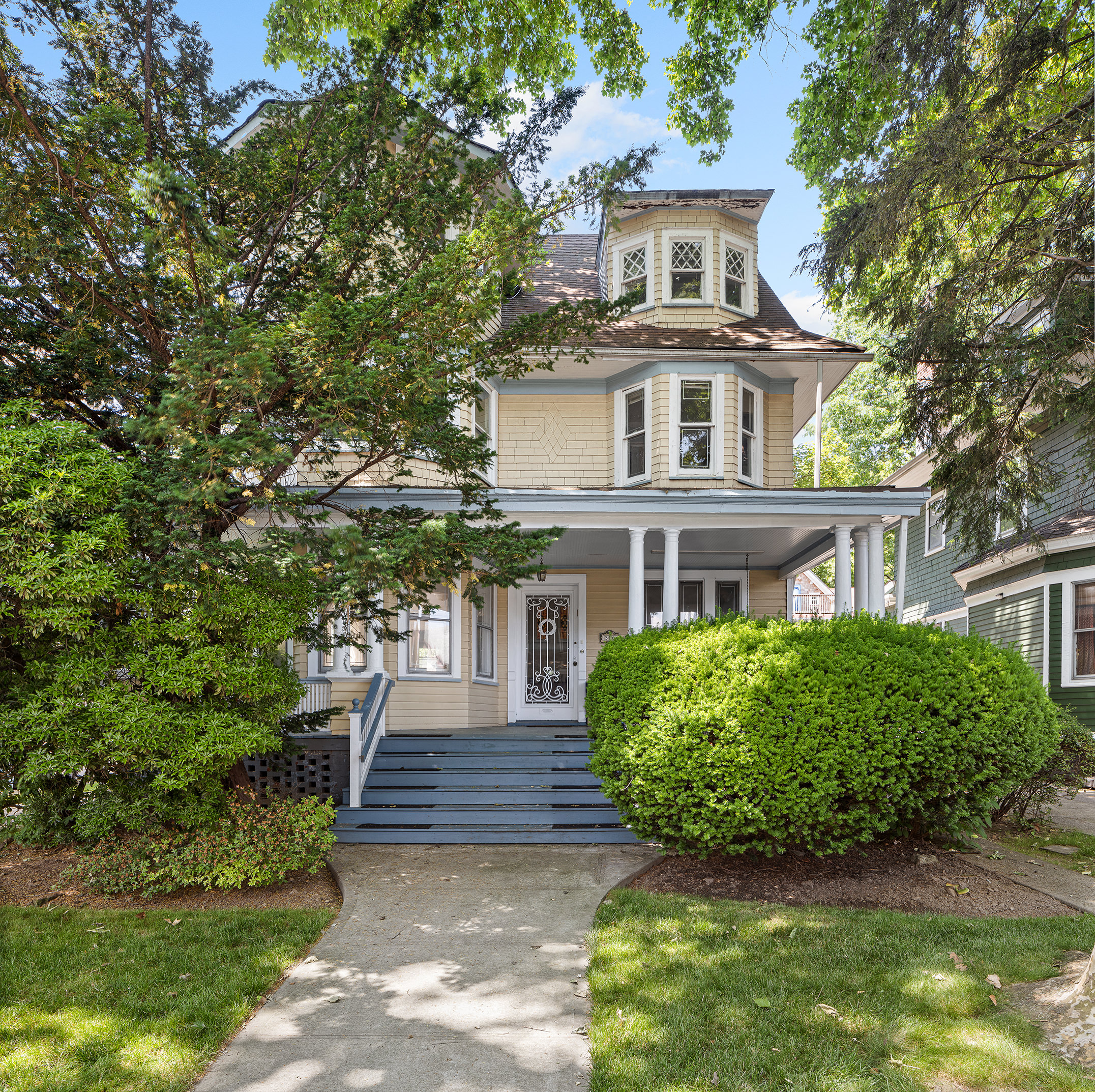 a front view of a house with garden