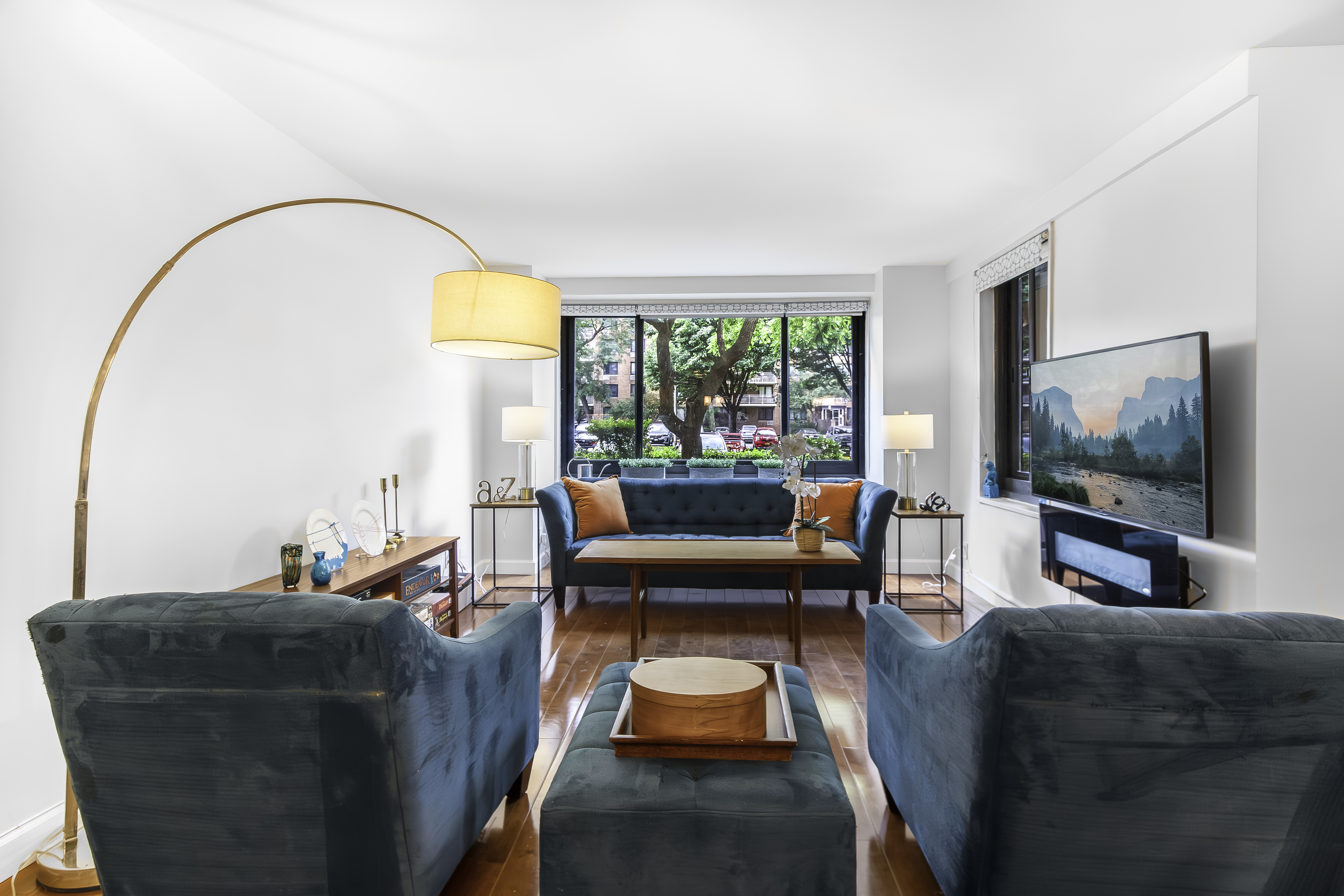 a living room with furniture and a flat screen tv