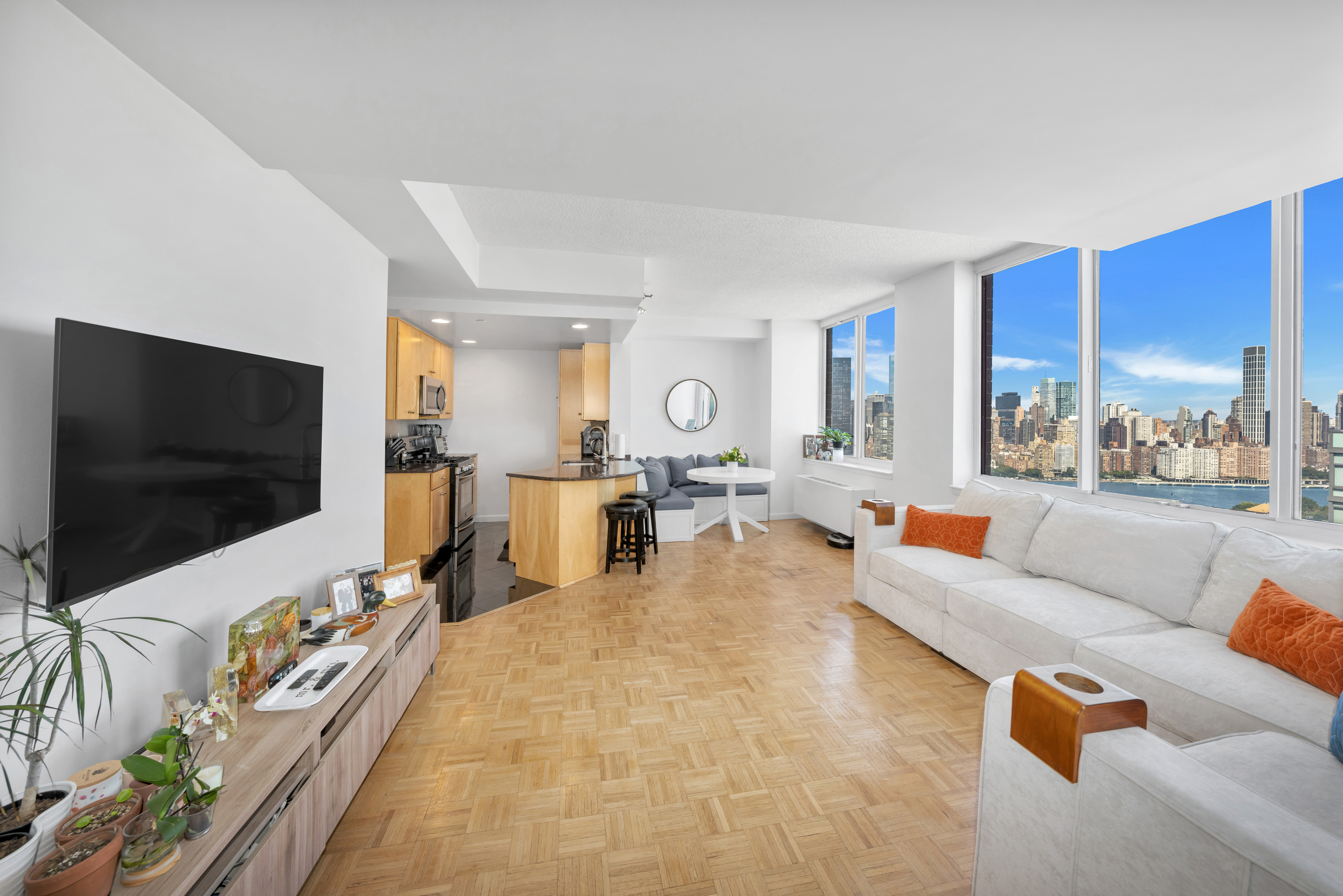 a living room with furniture and a flat screen tv