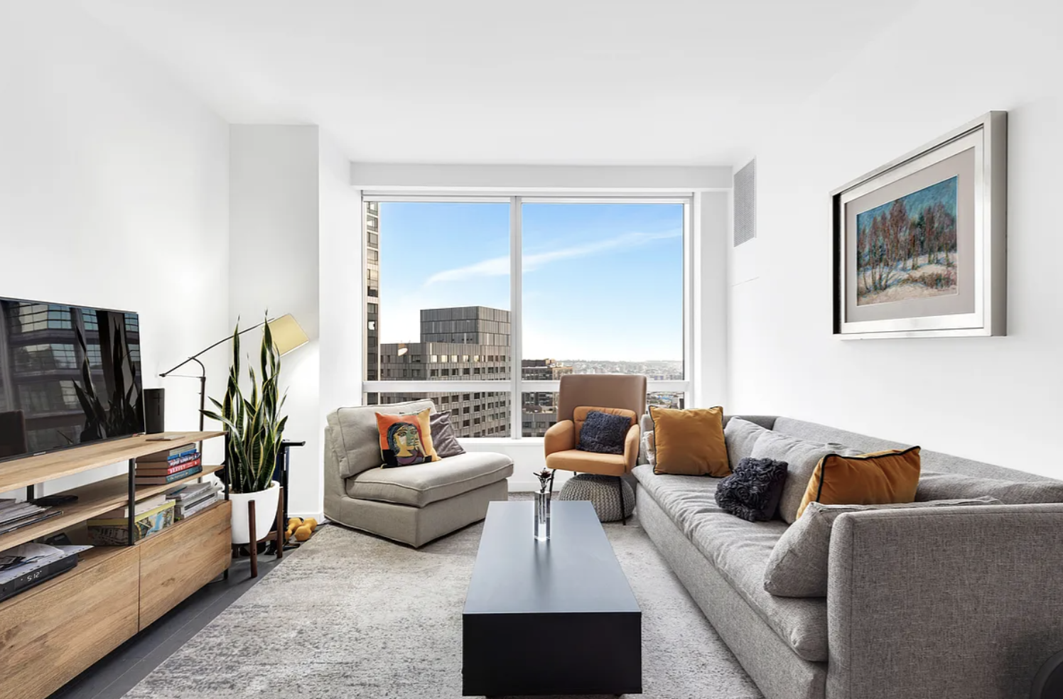 a living room with furniture and a flat screen tv