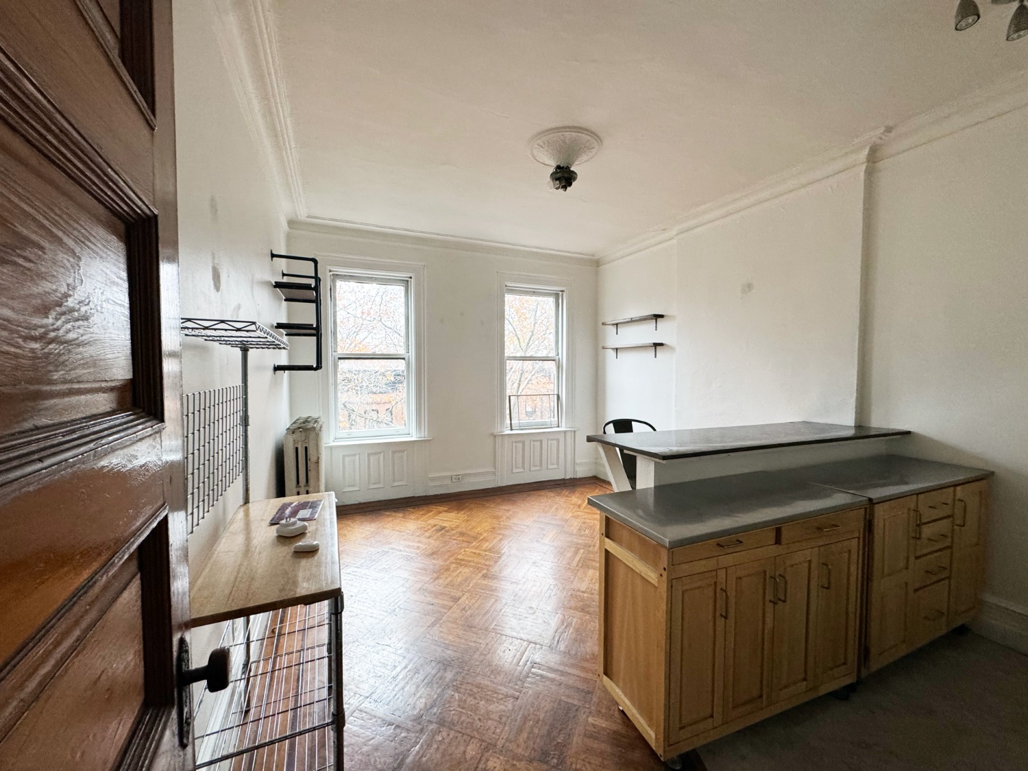 a kitchen with granite countertop a stove and cabinets