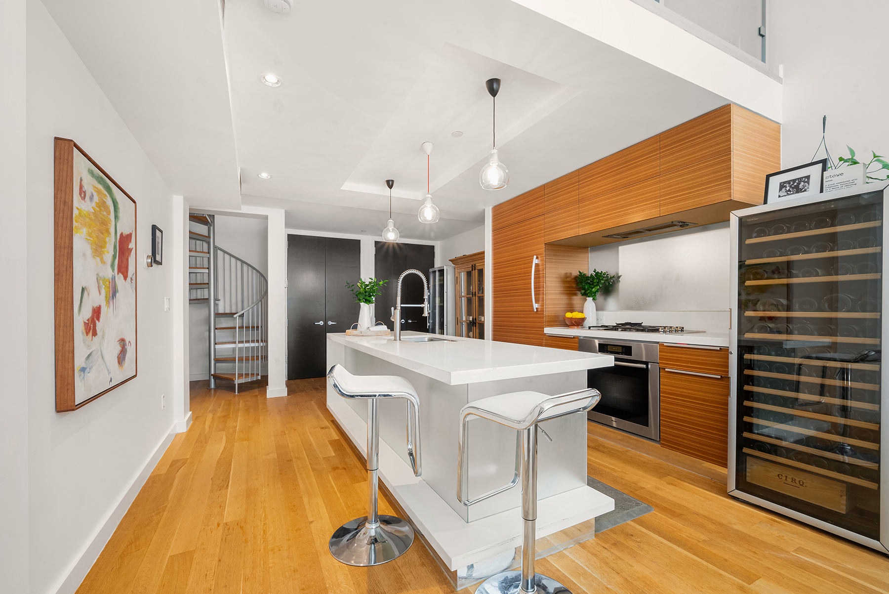 a living room with stainless steel appliances kitchen island granite countertop furniture and a kitchen view