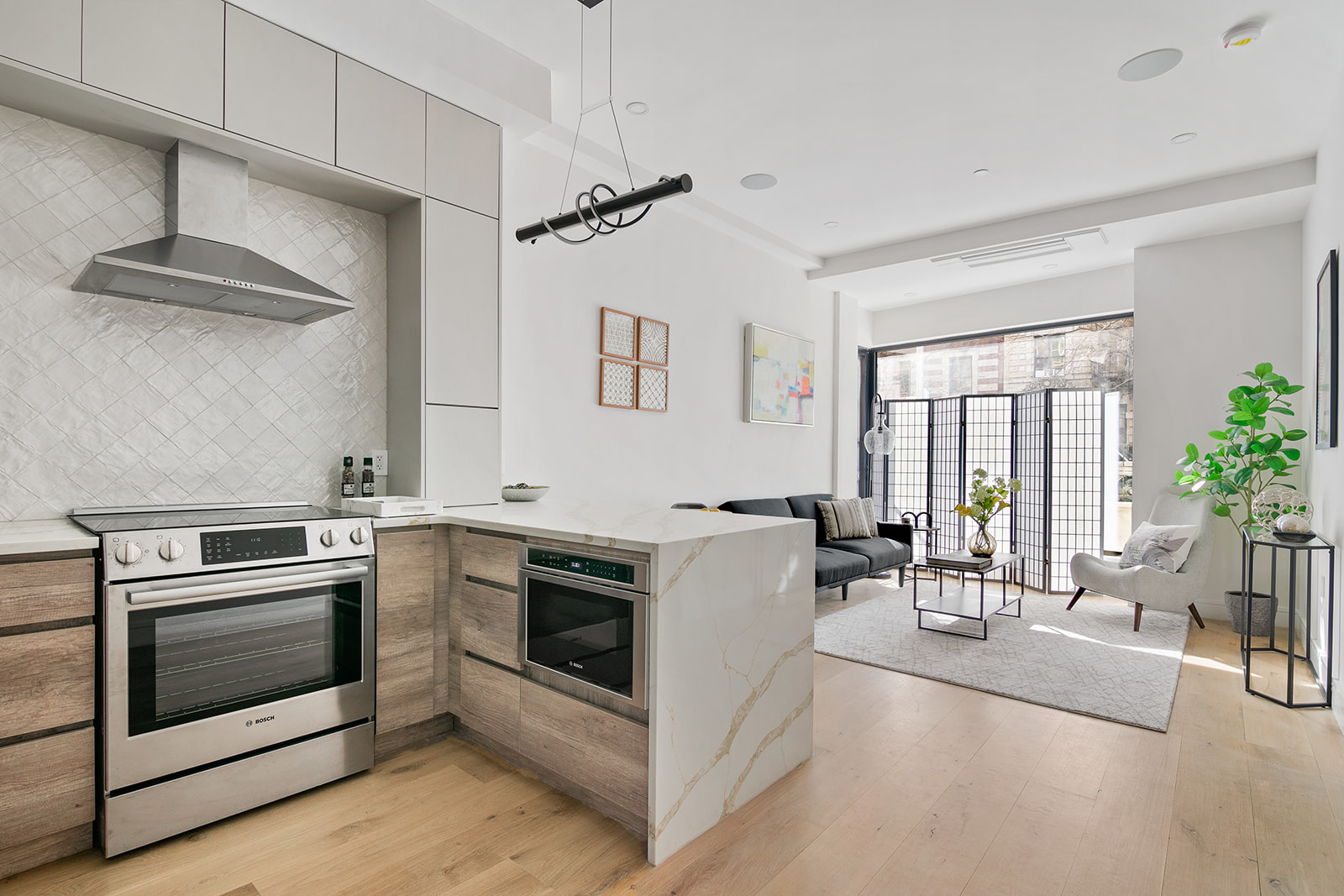 a kitchen with a stove and a white cabinets