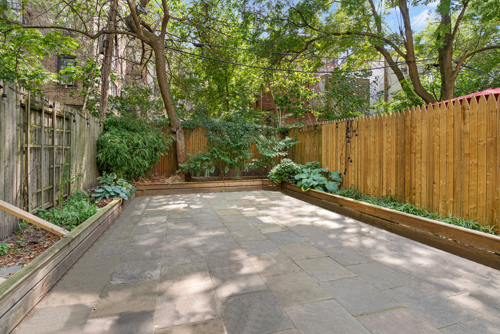 a view of a backyard with green space